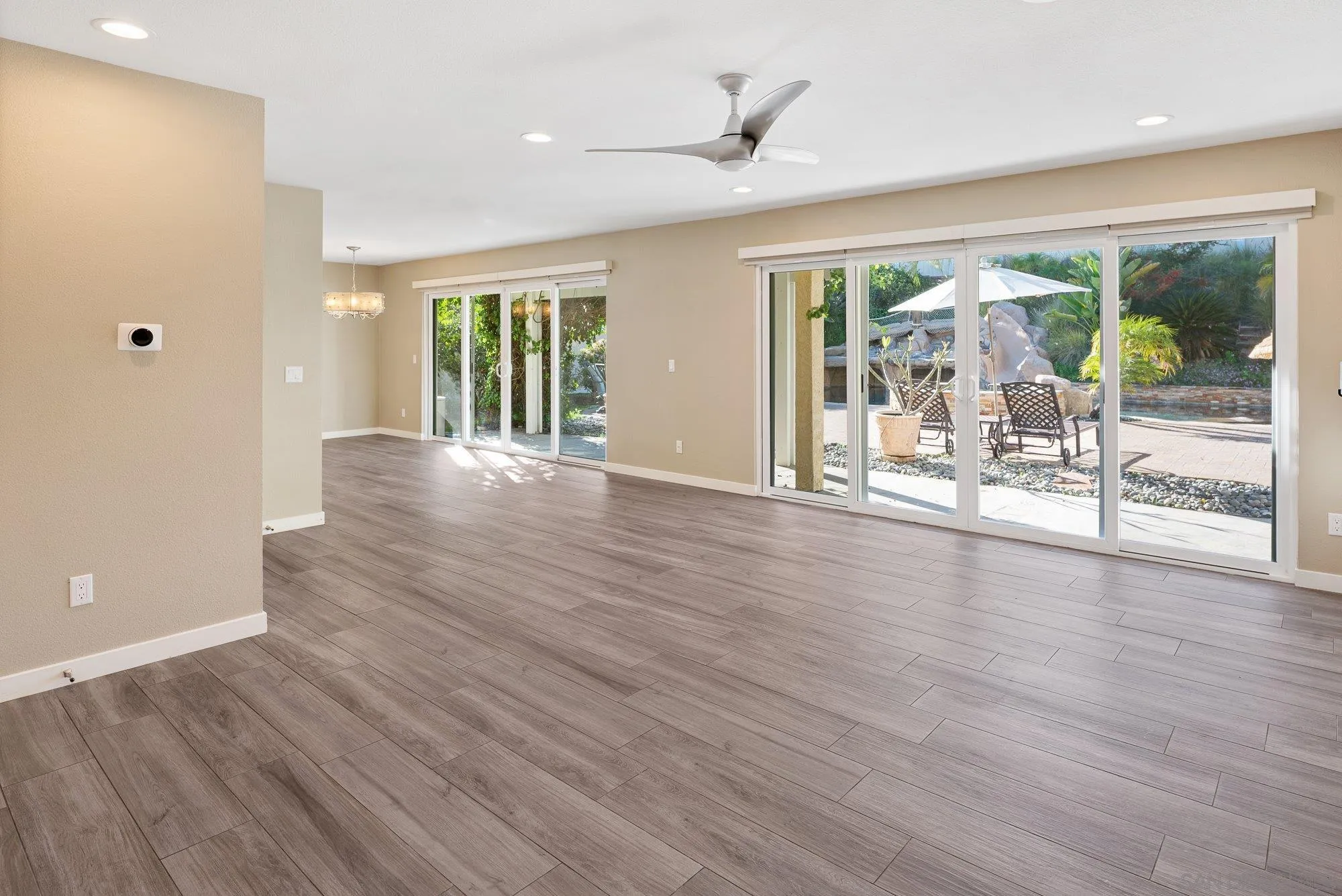 14274 Woodcreek Road Poway, CA 92064 - Photo 20 of 57 a view of a livingroom with wooden floor and furniture