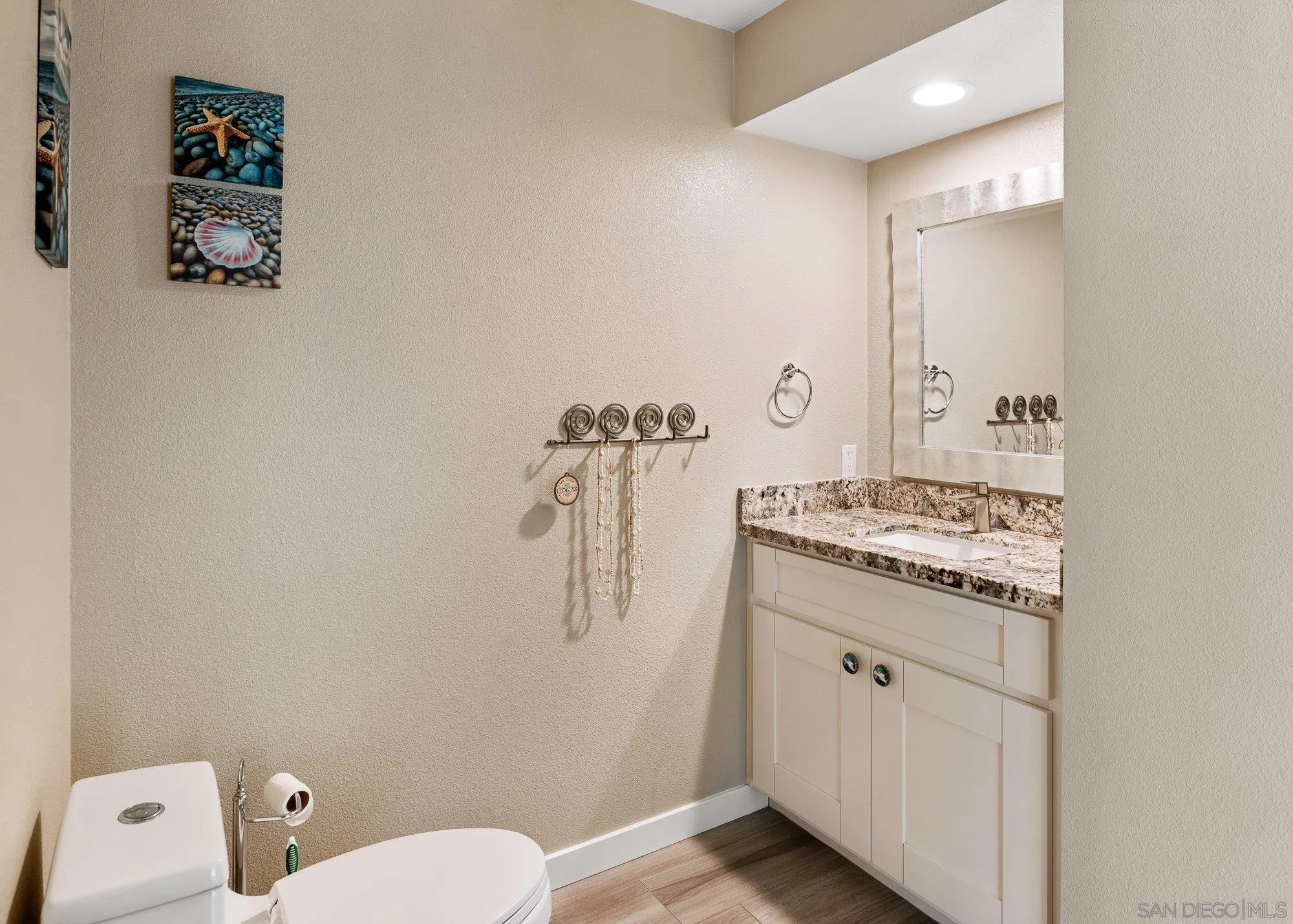 14274 Woodcreek Road Poway, CA 92064 - Photo 21 of 57 a bathroom with a granite countertop sink toilet and shower