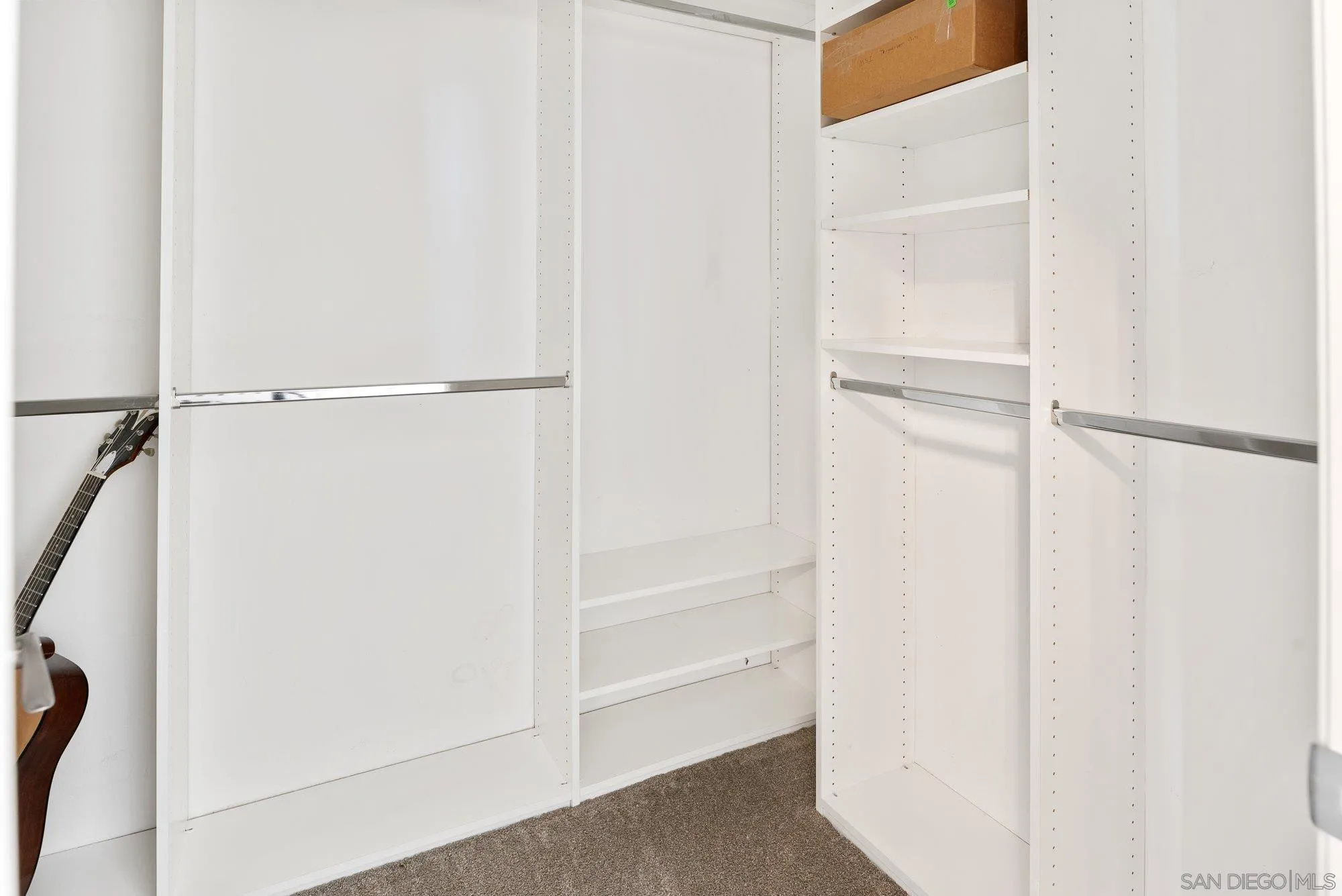14274 Woodcreek Road Poway, CA 92064 - Photo 25 of 57 a view of walk in closet with empty racks