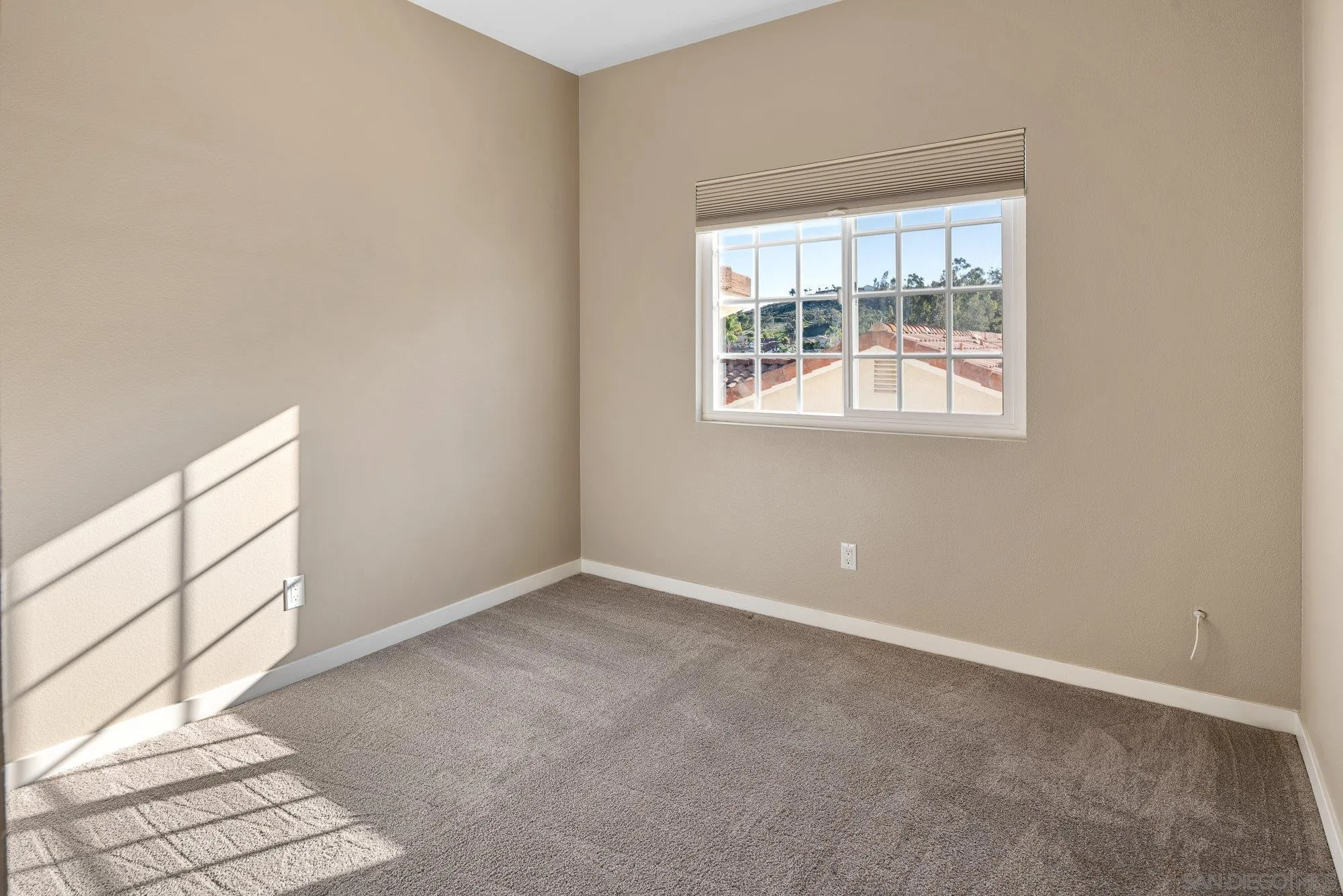 14274 Woodcreek Road Poway, CA 92064 - Photo 28 of 57 an empty room with windows