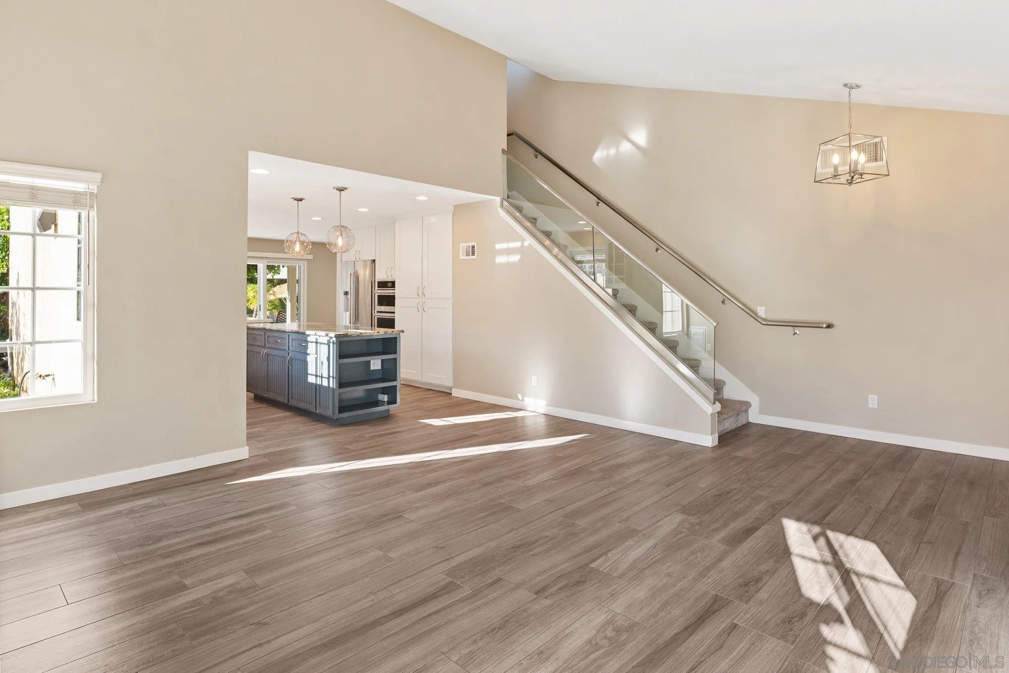 14274 Woodcreek Road Poway, CA 92064 - Photo 8 of 57 a view of empty room with wooden floor and fan