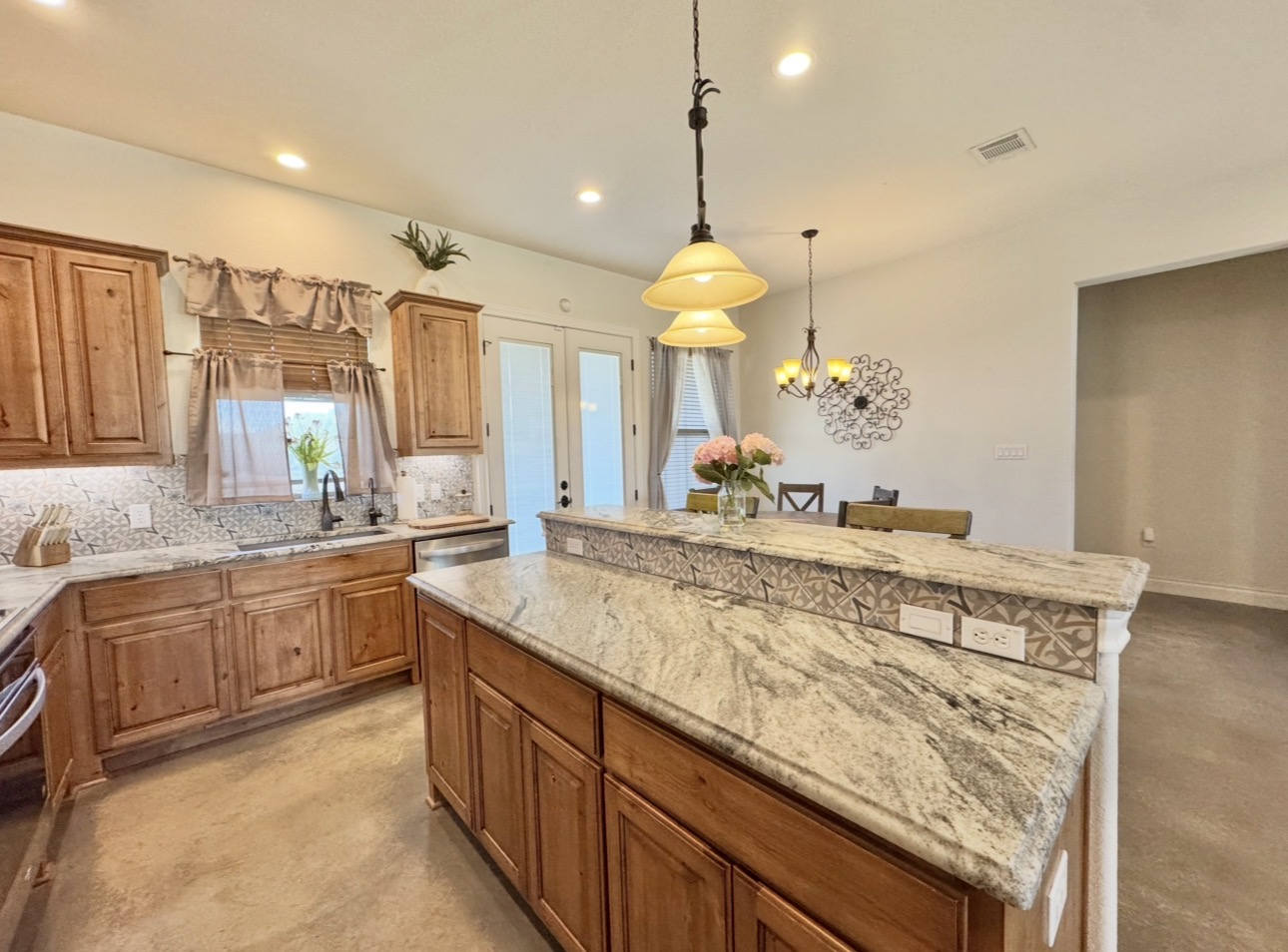 1094 Raintree Lane Elgin, TX 78621 - Photo 12 of 39 Center island with breakfast bar.