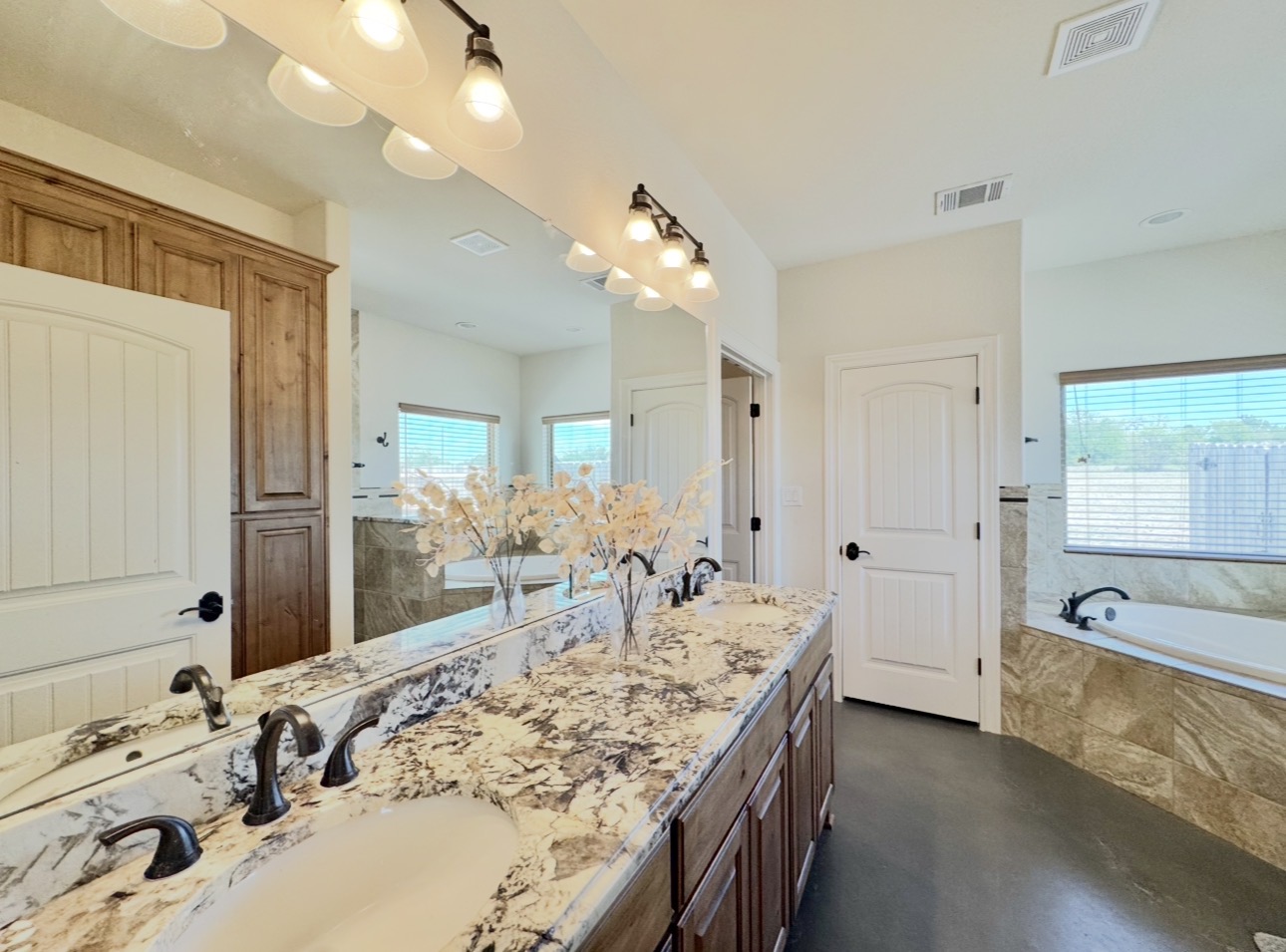 1094 Raintree Lane Elgin, TX 78621 - Photo 25 of 39 His and her vanities, garden soaker tub.