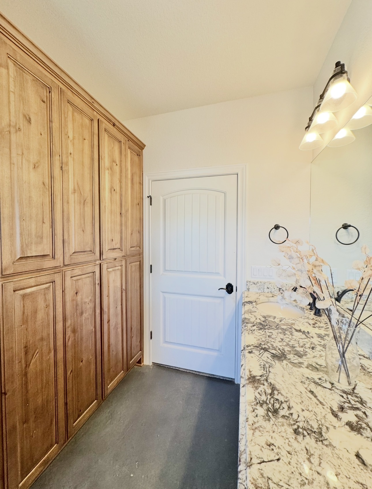 1094 Raintree Lane Elgin, TX 78621 - Photo 28 of 39 Built in floor to ceiling custom cabinet storage.