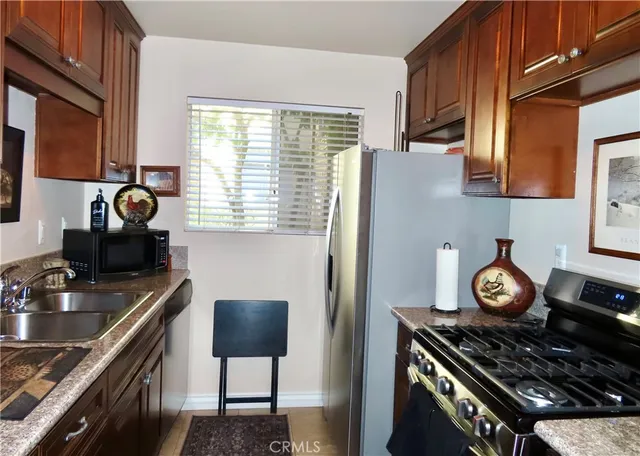 a kitchen with a stove and a sink