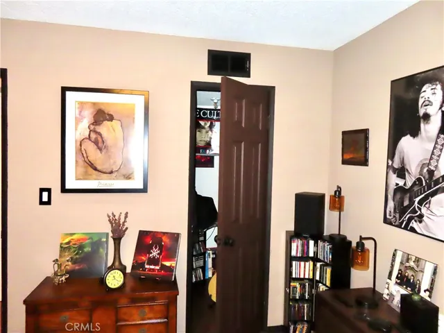 a view of living room with furniture and wooden floor