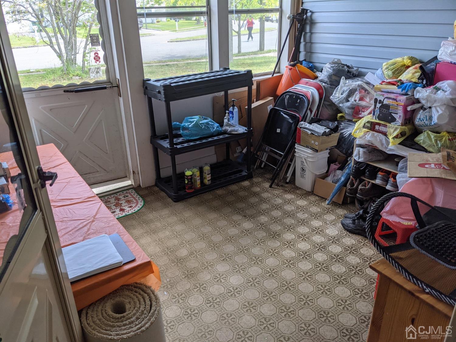 122 Woodbury Road Edison, NJ 08820 - Photo 14 of 18 a room filled with furniture and a window