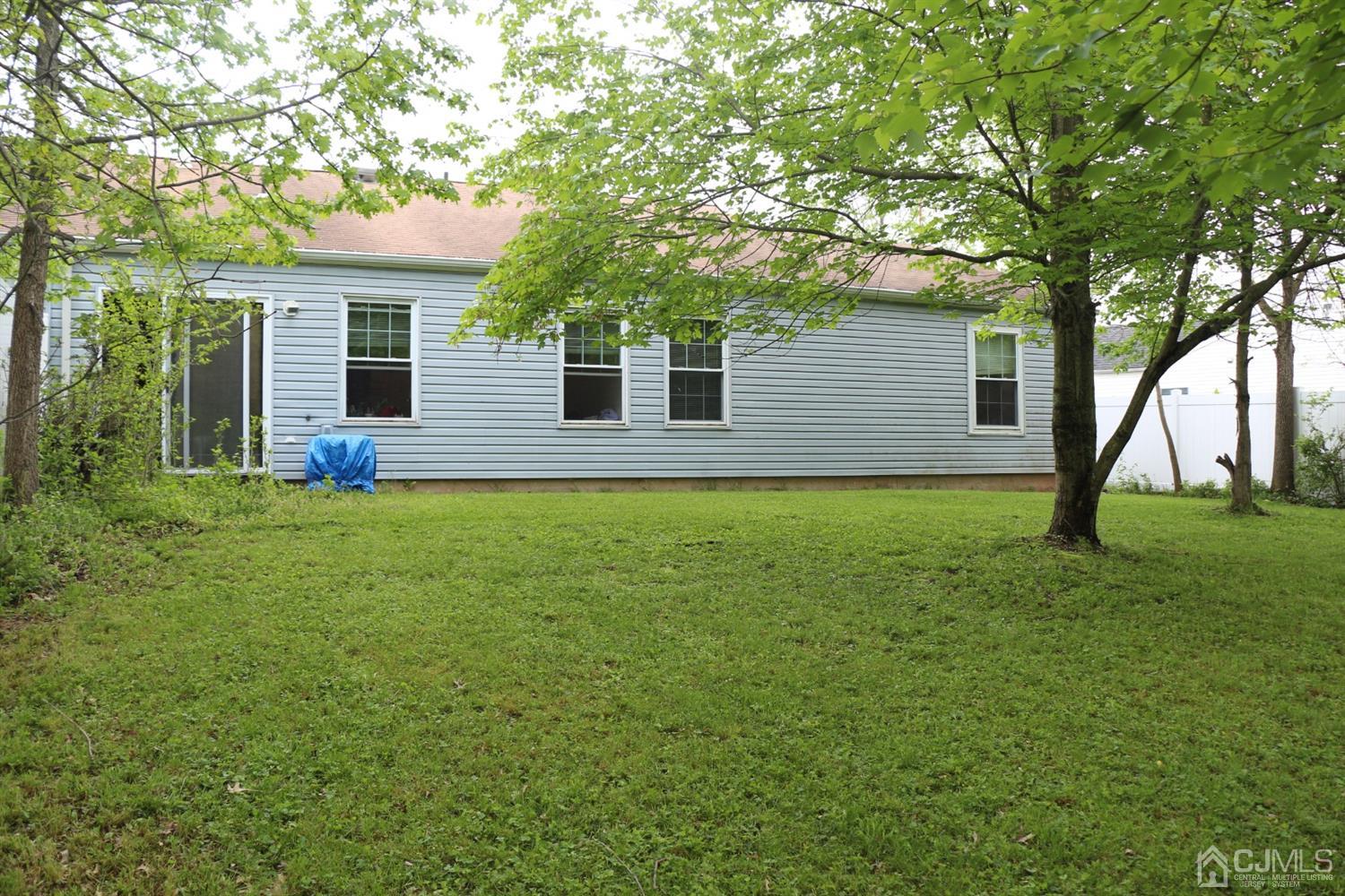 122 Woodbury Road Edison, NJ 08820 - Photo 8 of 18 a house view with a garden space