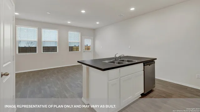 a view of a hallway with white walls