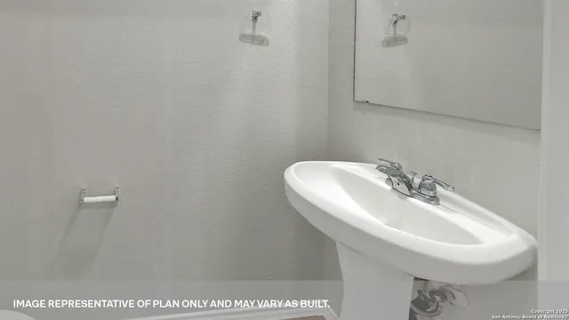 a kitchen that has a sink and a stove