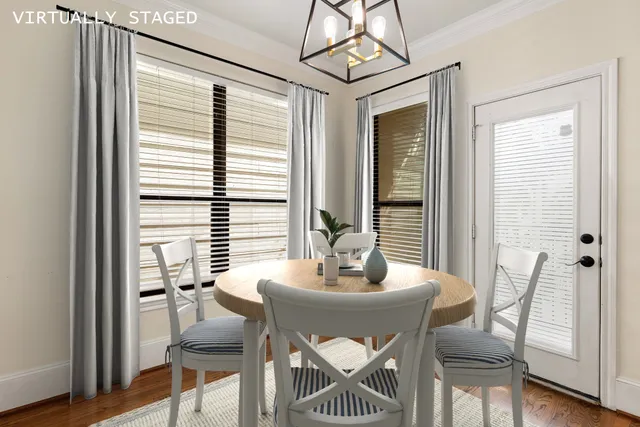 a dining room with furniture and window