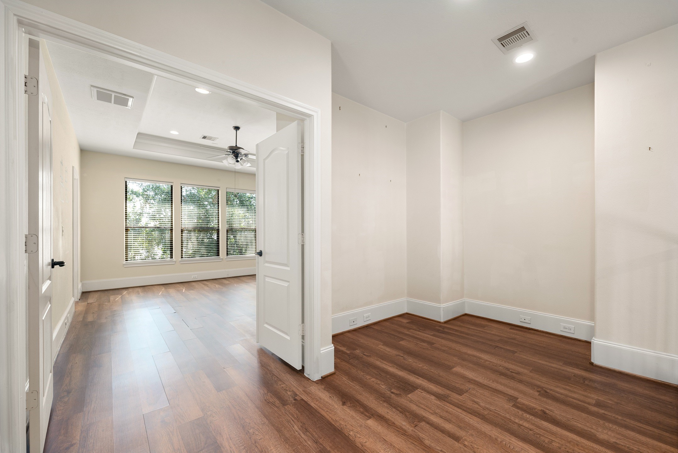1353 Studer Street Houston, TX 77007 - Photo 15 of 35 an empty room with wooden floor and windows