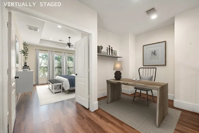 a work room with furniture and wooden floor