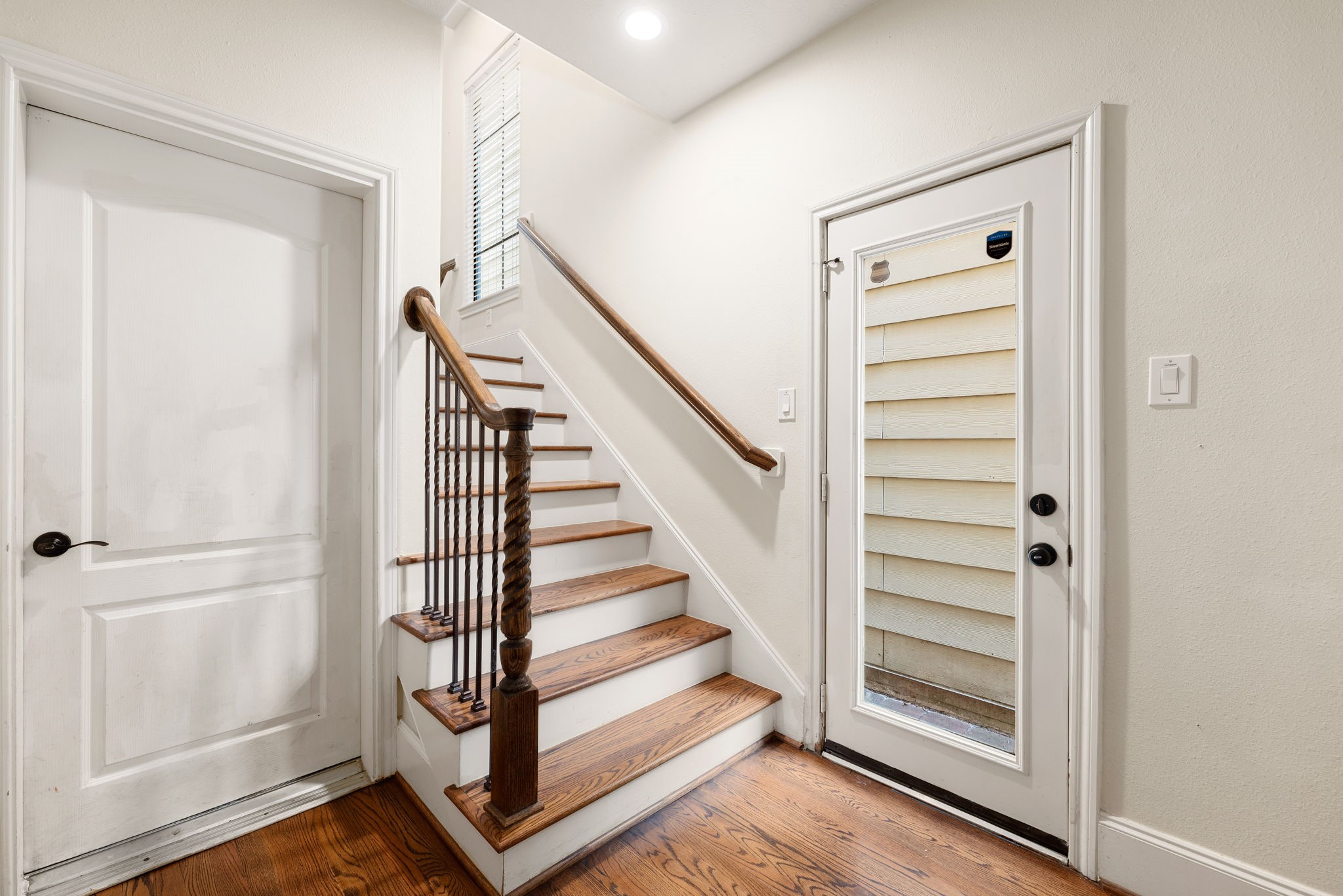 1353 Studer Street Houston, TX 77007 - Photo 21 of 35 a view of a hallway with wooden floor and entryway