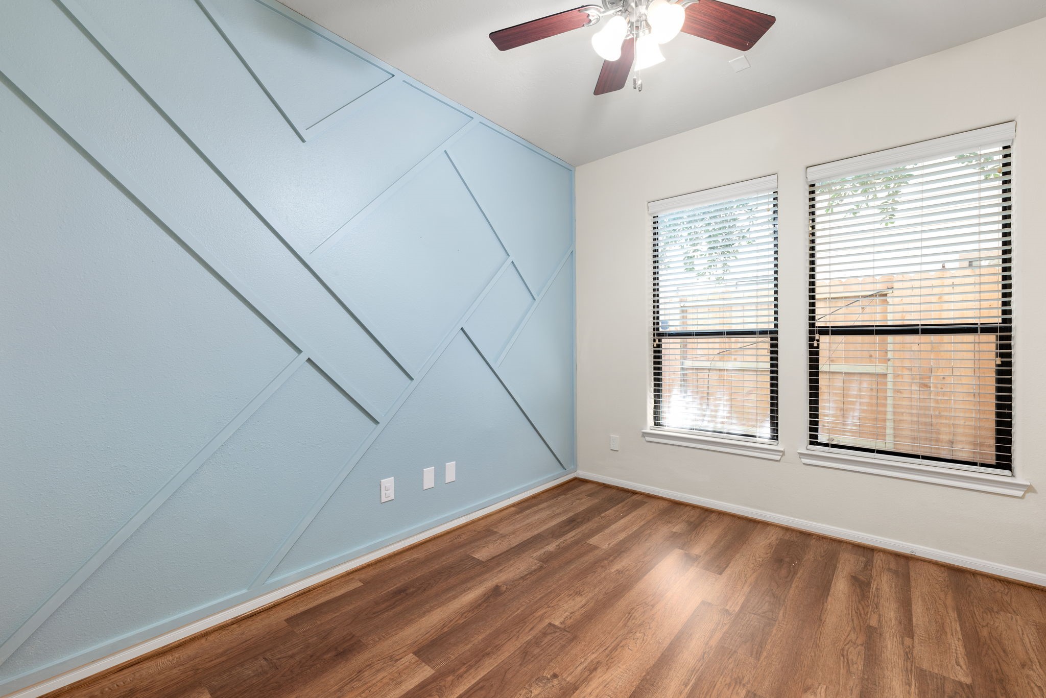 1353 Studer Street Houston, TX 77007 - Photo 23 of 35 a view of empty room with wooden floor and fan