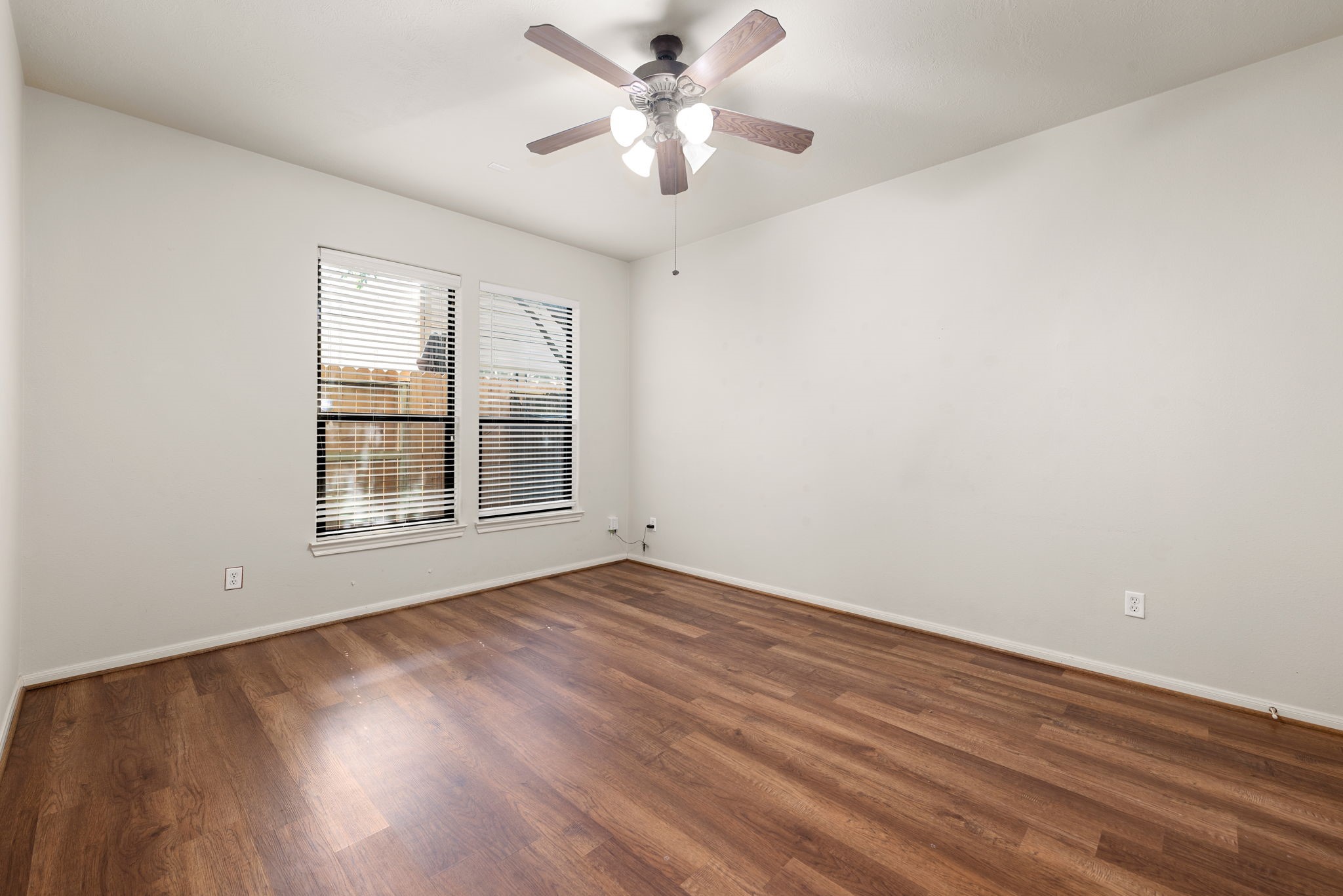 1353 Studer Street Houston, TX 77007 - Photo 28 of 35 a view of an empty room with window and wooden floor
