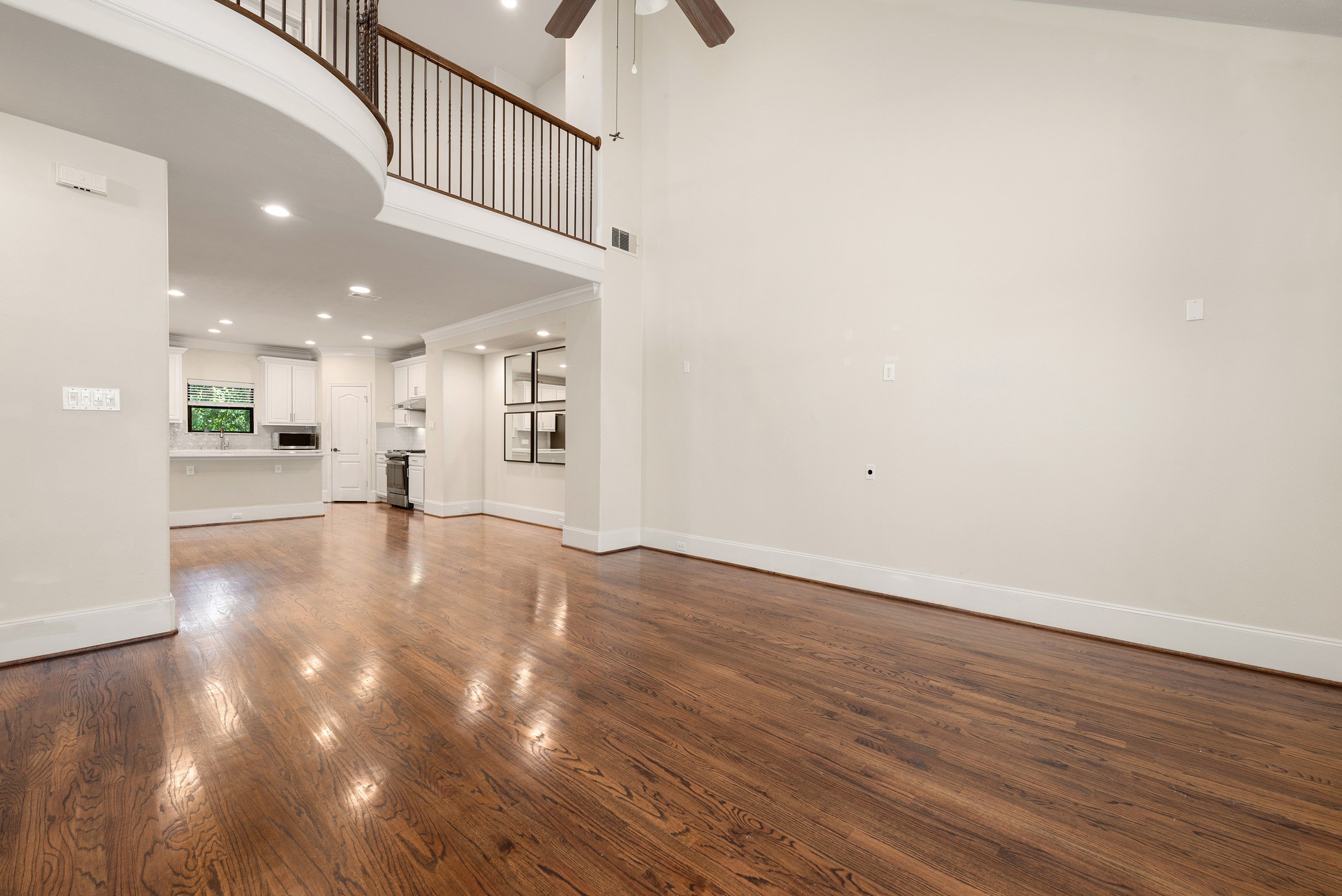 1353 Studer Street Houston, TX 77007 - Photo 7 of 35 a view of an empty room with wooden floor