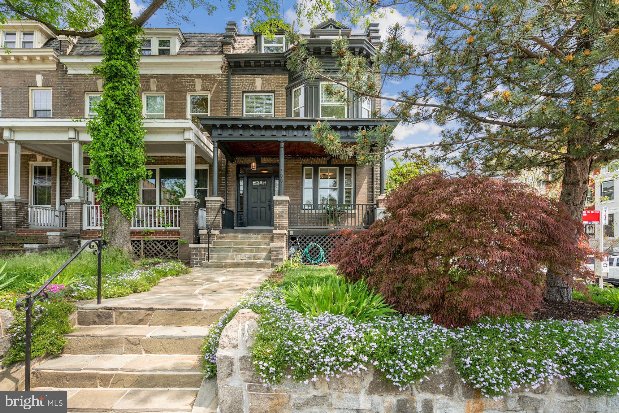 3001 13th Street Northwest, Unit B Washington, DC 20009 - Photo 1 of 11 a front view of a house with garden