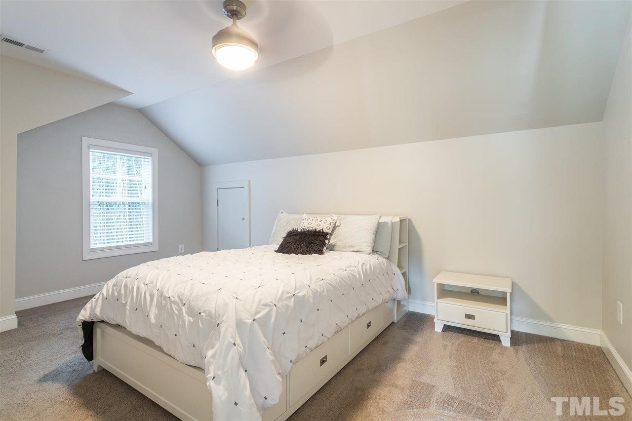 5316 Olive Road Raleigh, NC 27606 - Photo 19 of 29 a bedroom with a bed and a window