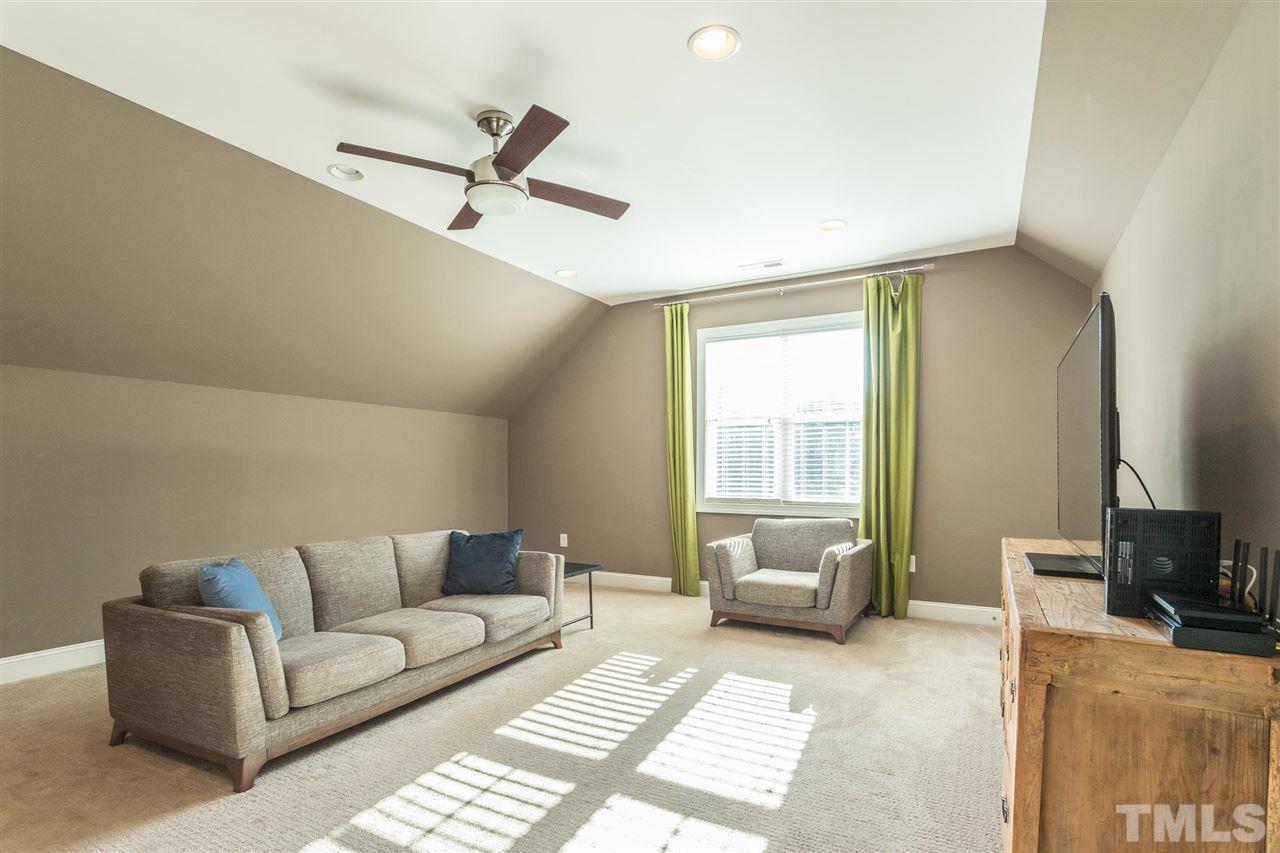 5316 Olive Road Raleigh, NC 27606 - Photo 21 of 29 a living room with furniture and a window