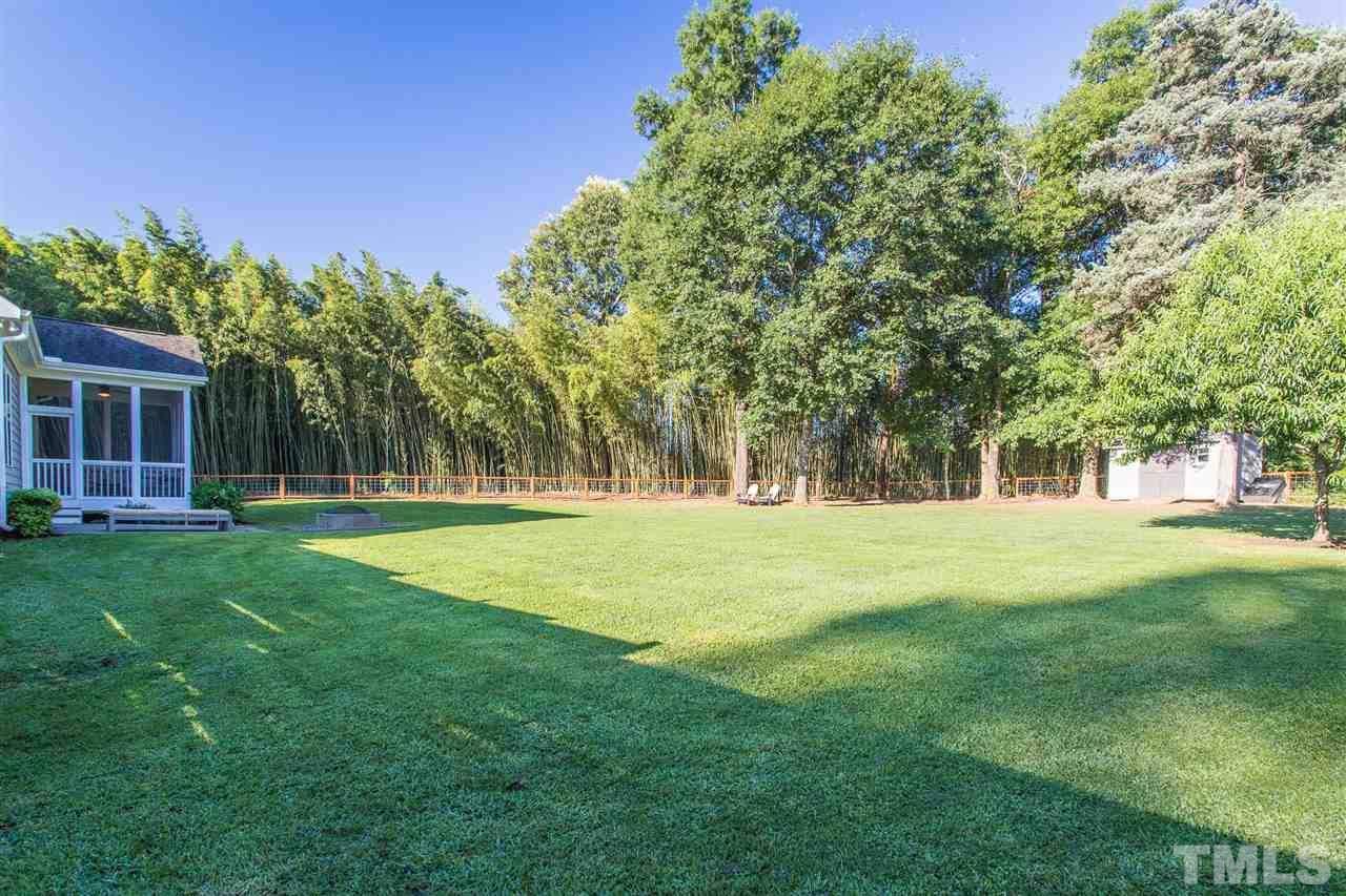 5316 Olive Road Raleigh, NC 27606 - Photo 27 of 29 a huge green field with lots of trees