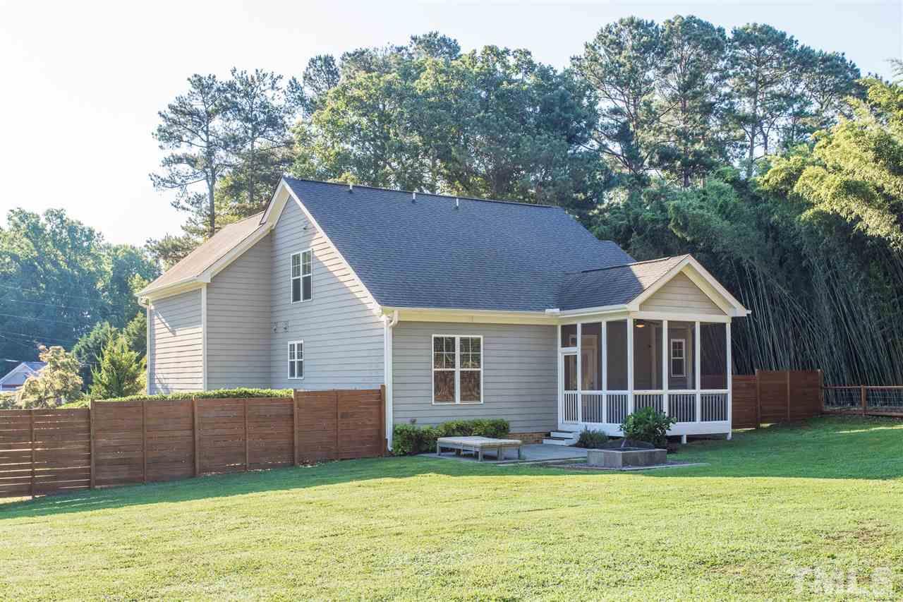 5316 Olive Road Raleigh, NC 27606 - Photo 29 of 29 a view of a house with a yard and large trees