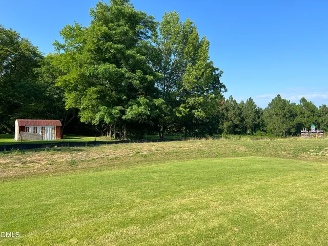 a view of a pool with a yard