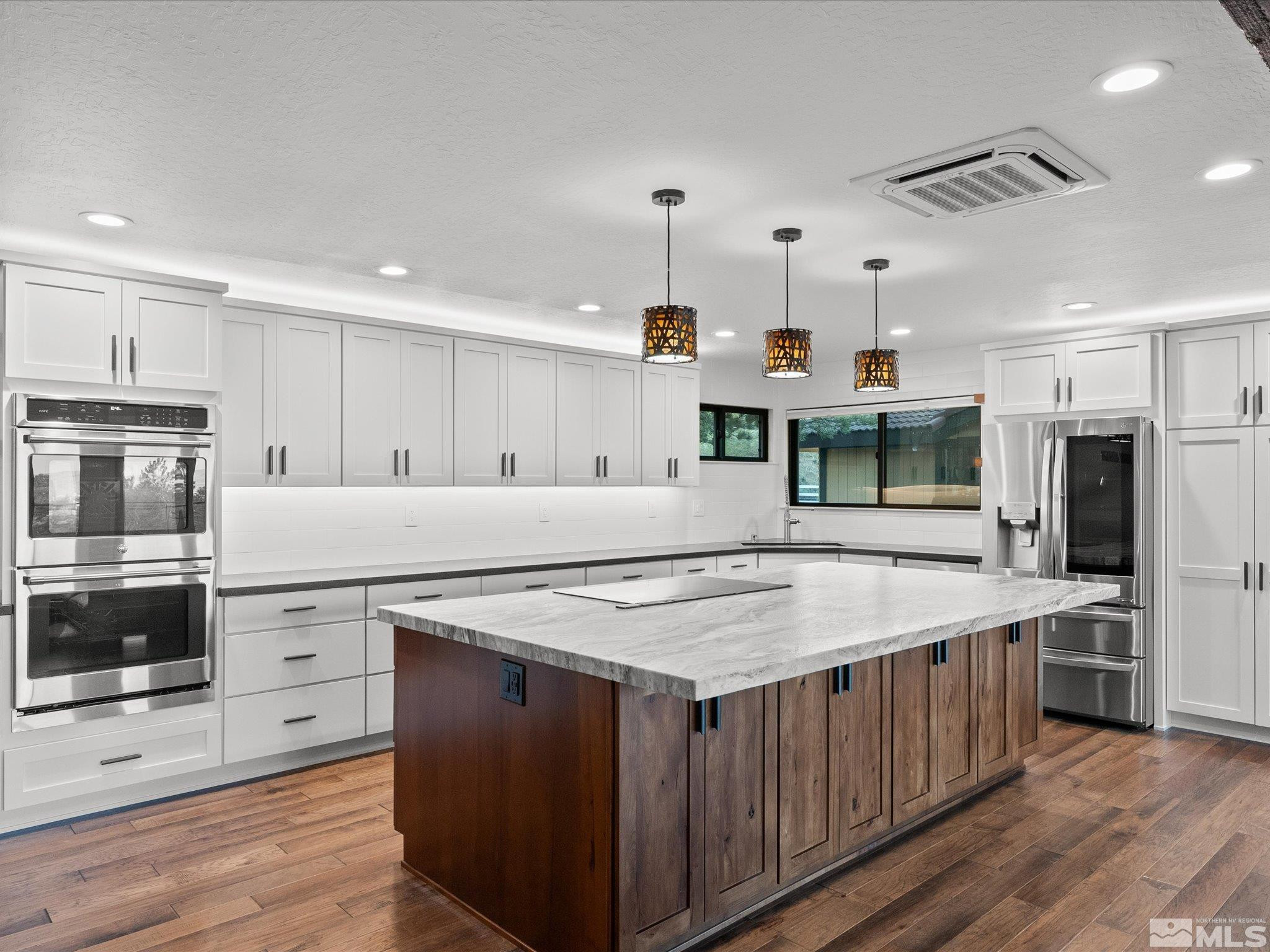 2036 Breen Drive Reno, NV 89509 - Photo 13 of 38 a kitchen with a stove a refrigerator and a oven