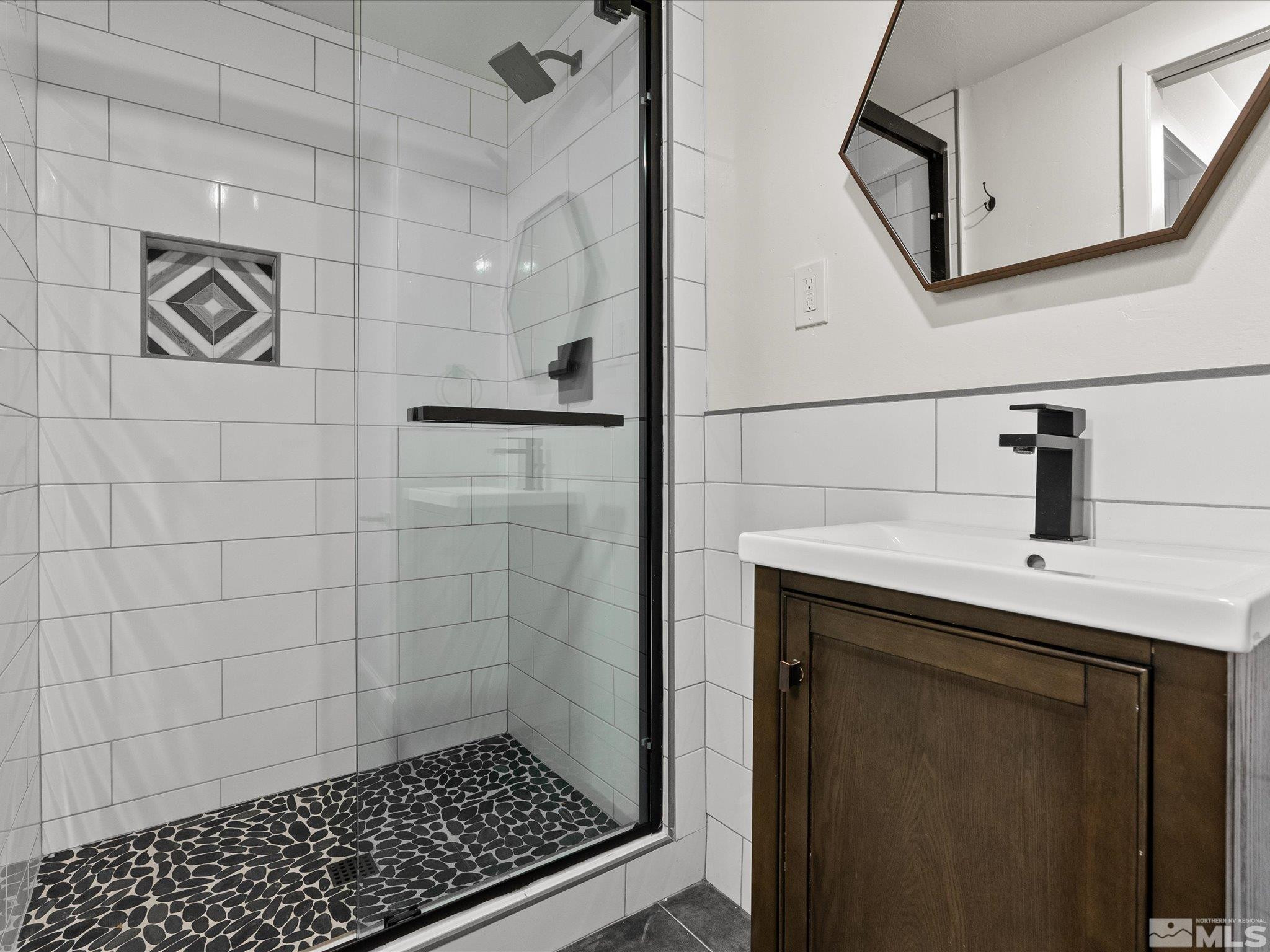 2036 Breen Drive Reno, NV 89509 - Photo 20 of 38 a bathroom with a sink a toilet a mirror and shower
