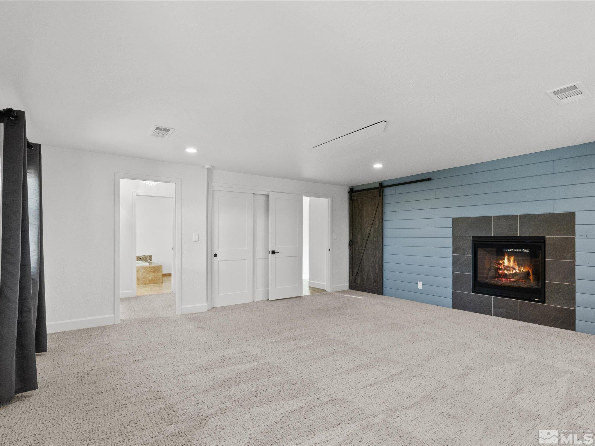 2036 Breen Drive Reno, NV 89509 - Photo 21 of 38 a view of an empty room with a fireplace