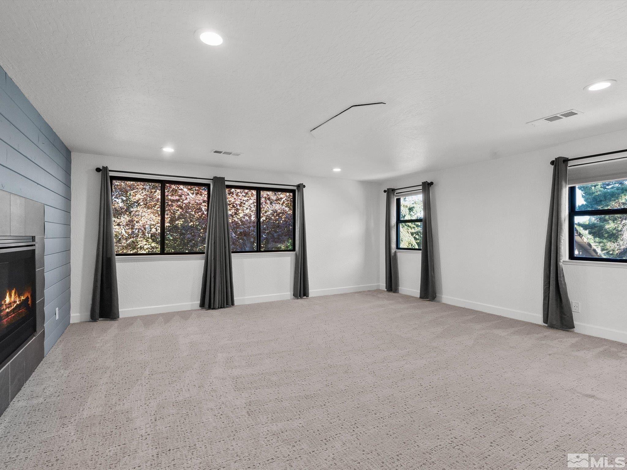 2036 Breen Drive Reno, NV 89509 - Photo 22 of 38 a view of an empty room with window and fire place