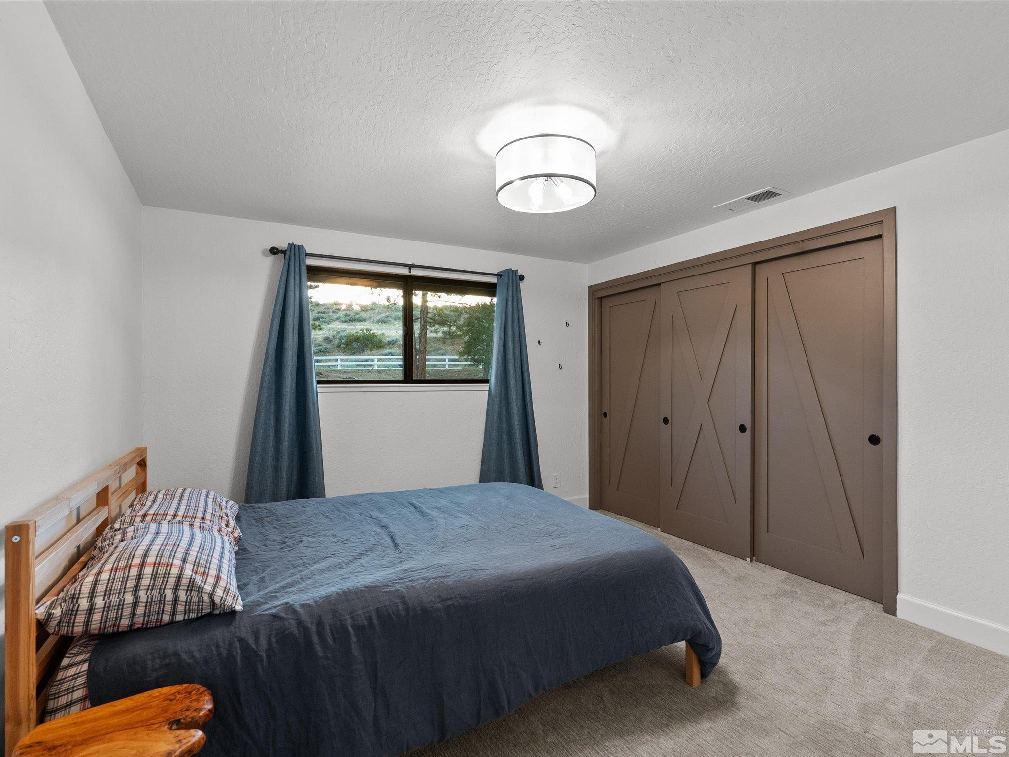 2036 Breen Drive Reno, NV 89509 - Photo 25 of 38 a bedroom with a bed and a window