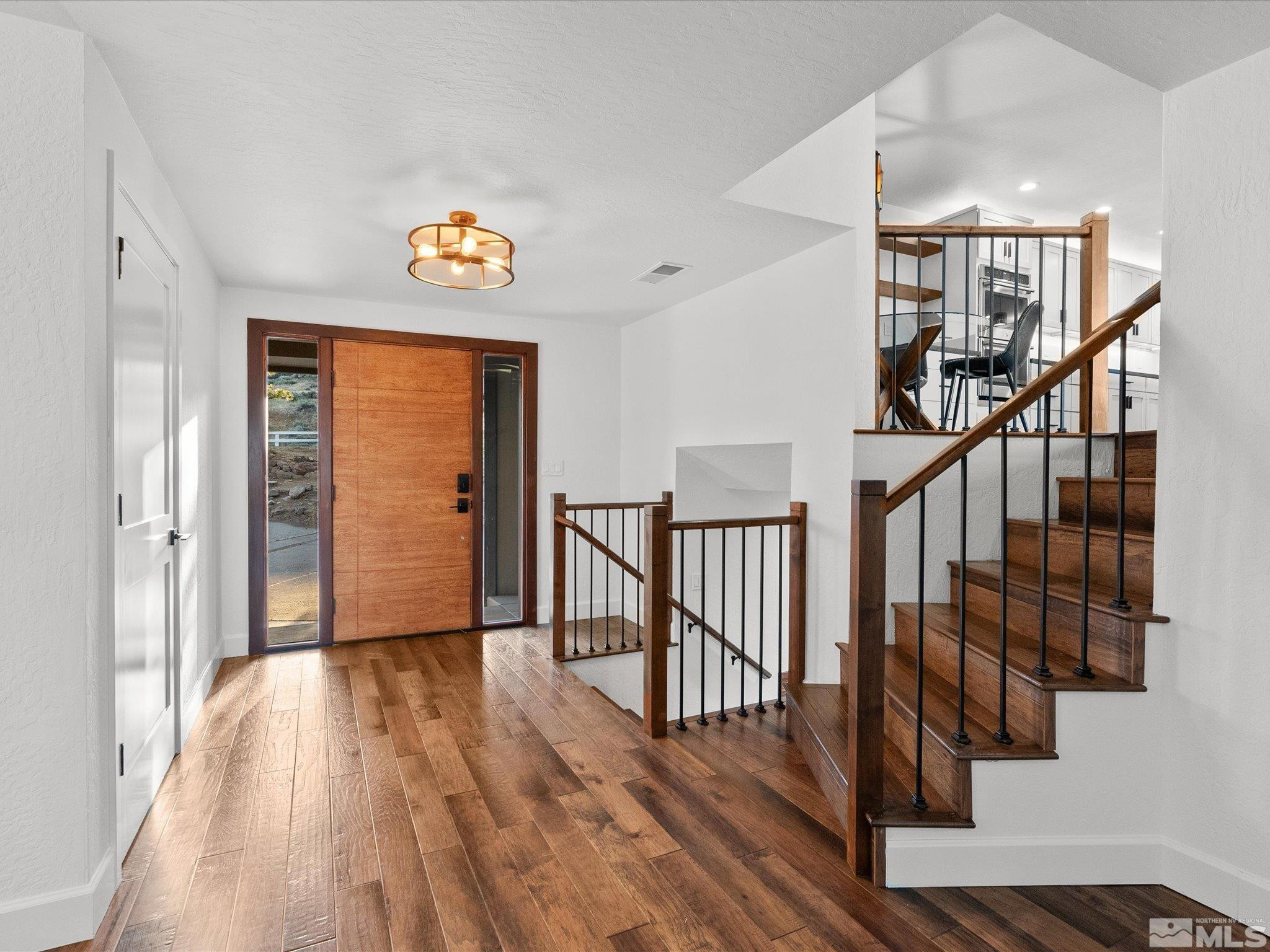 2036 Breen Drive Reno, NV 89509 - Photo 5 of 38 a view of hallway with wooden floor and stairs