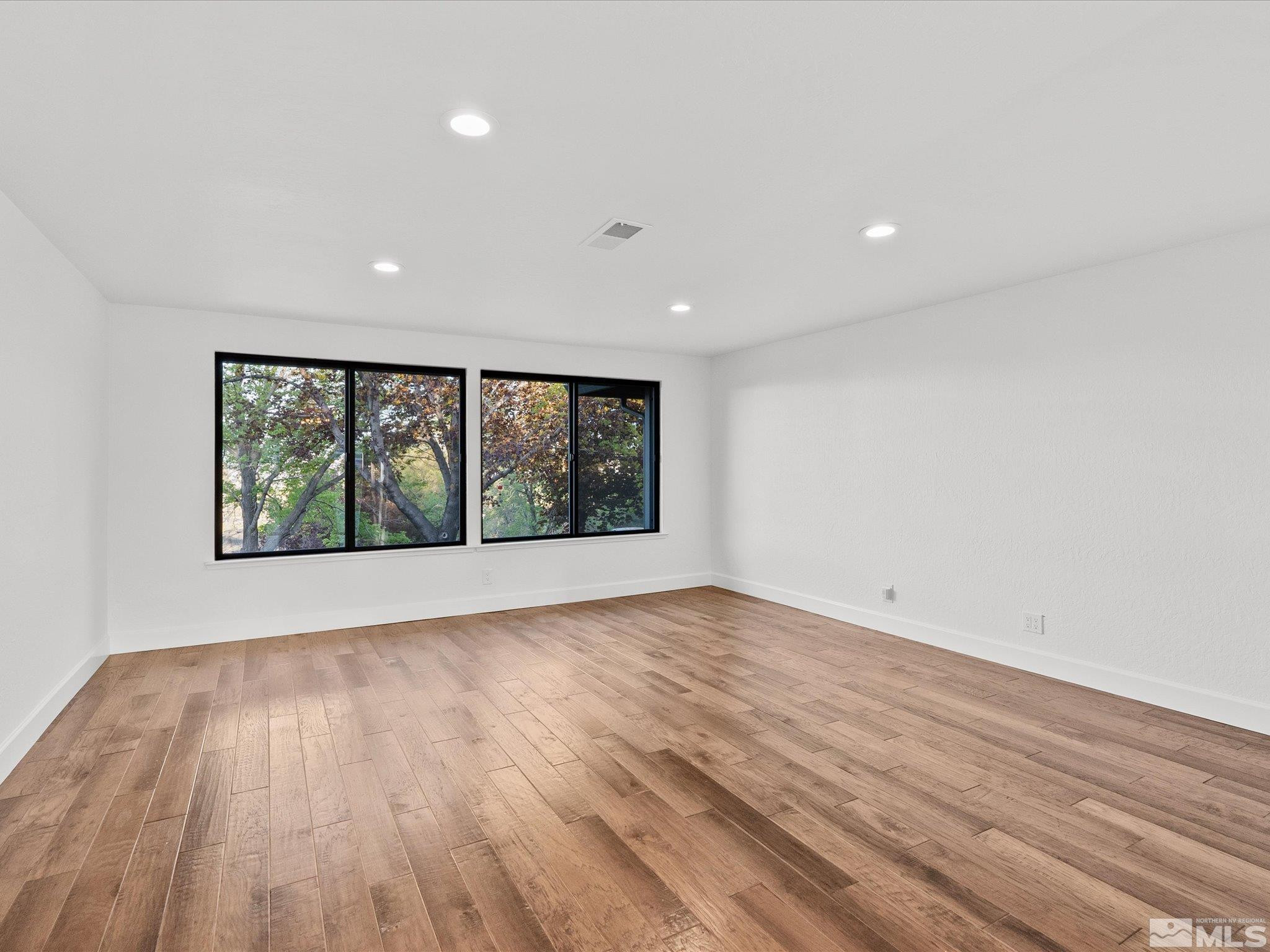 2036 Breen Drive Reno, NV 89509 - Photo 6 of 38 wooden floor in an empty room with a window