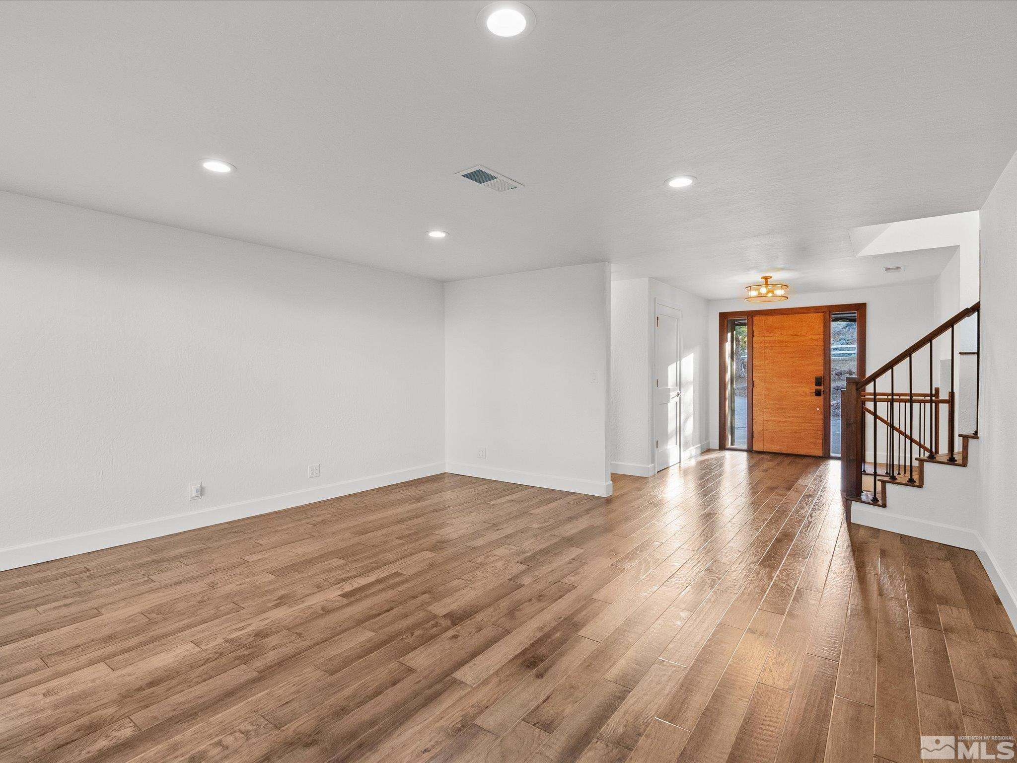 2036 Breen Drive Reno, NV 89509 - Photo 7 of 38 a view of an empty room with wooden floor