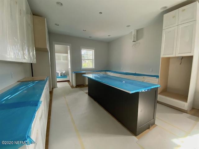 420 Ridgeway Road St. Augustine, FL 32080 - Photo 6 of 17 a kitchen with stainless steel appliances granite countertop a refrigerator a sink and a stove