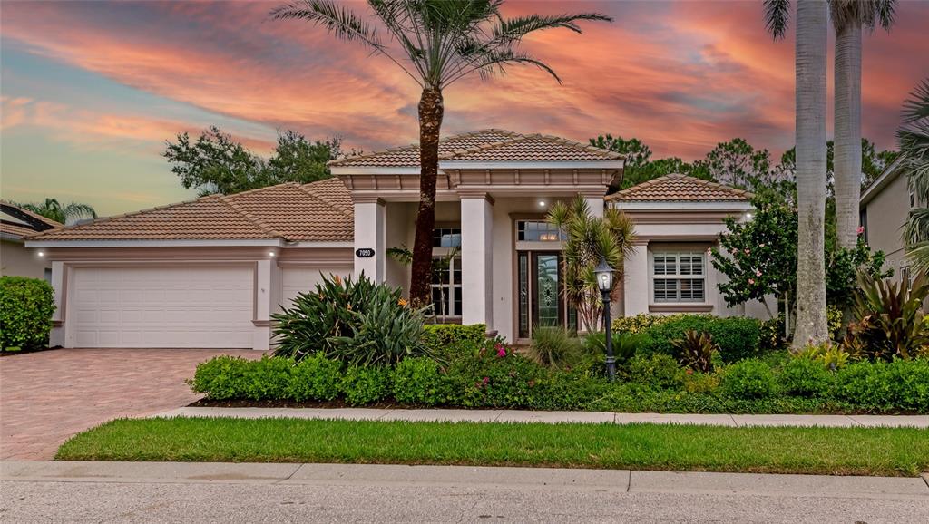 7050 Scrub Jay Drive Sarasota, FL 34241 - Photo 1 of 1 a front view of a house with a garden