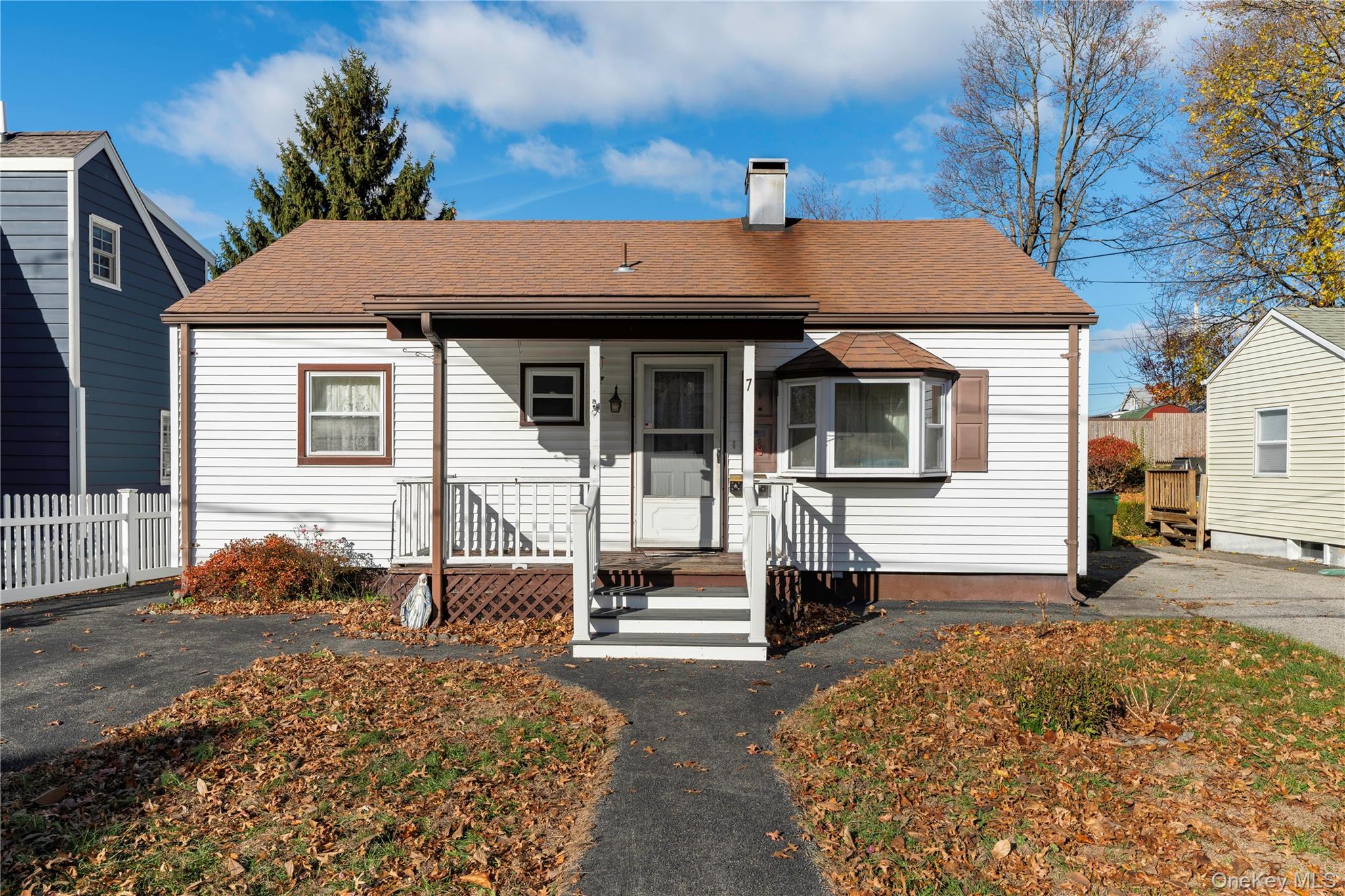 a front view of a house with a porch