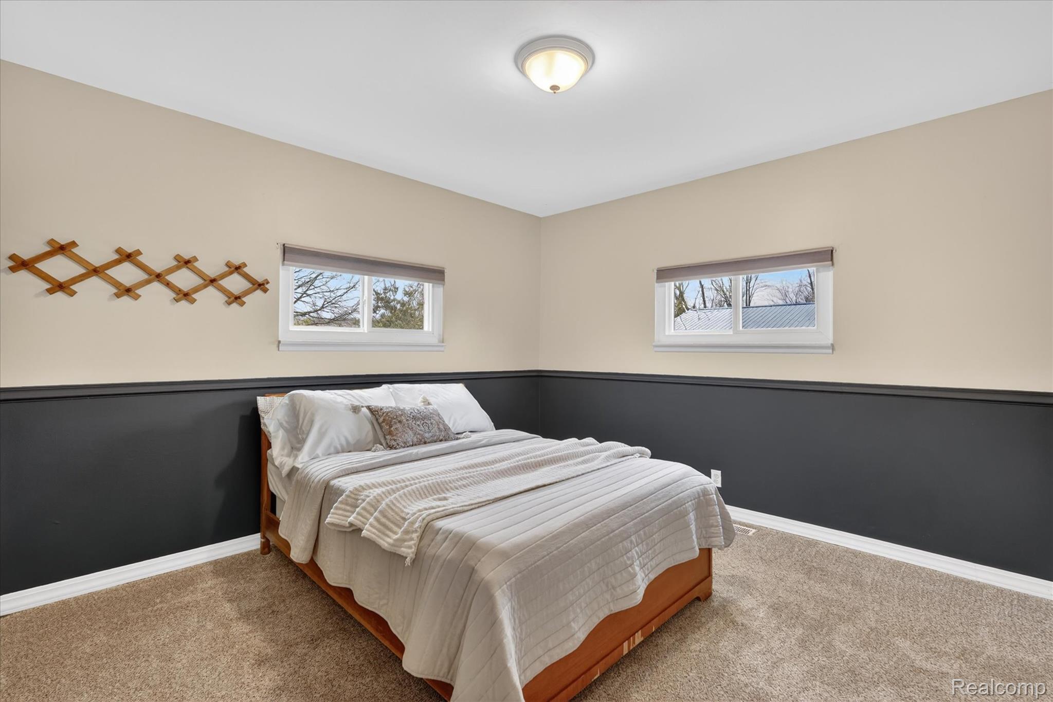 13508 North Center Road Clio, MI 48420 - Photo 23 of 38 Carpeted bedroom featuring multiple windows