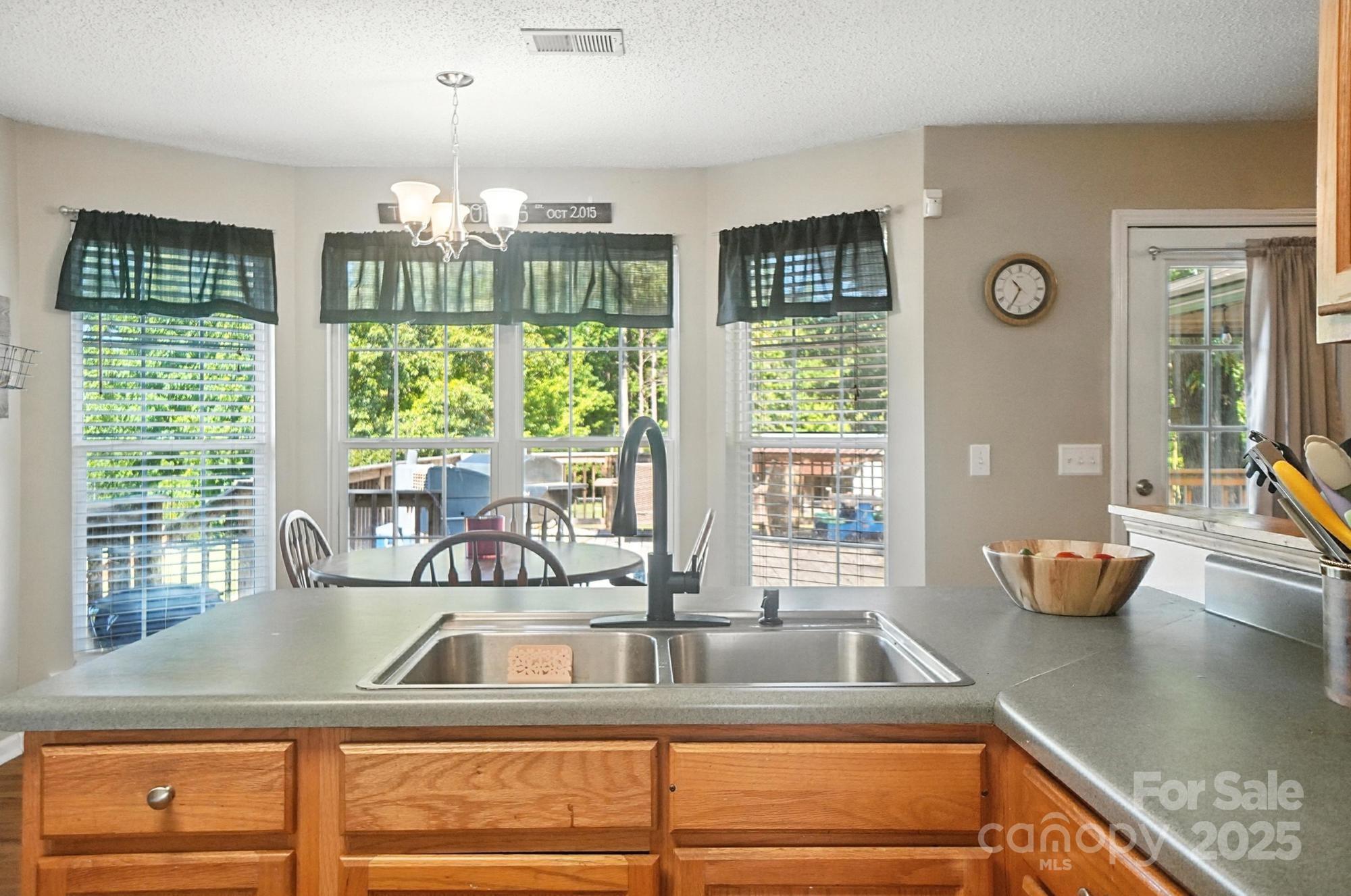 1116 State Rd S-29-770 Kershaw, SC 29067 - Photo 11 of 48 a kitchen with granite countertop a sink and a window