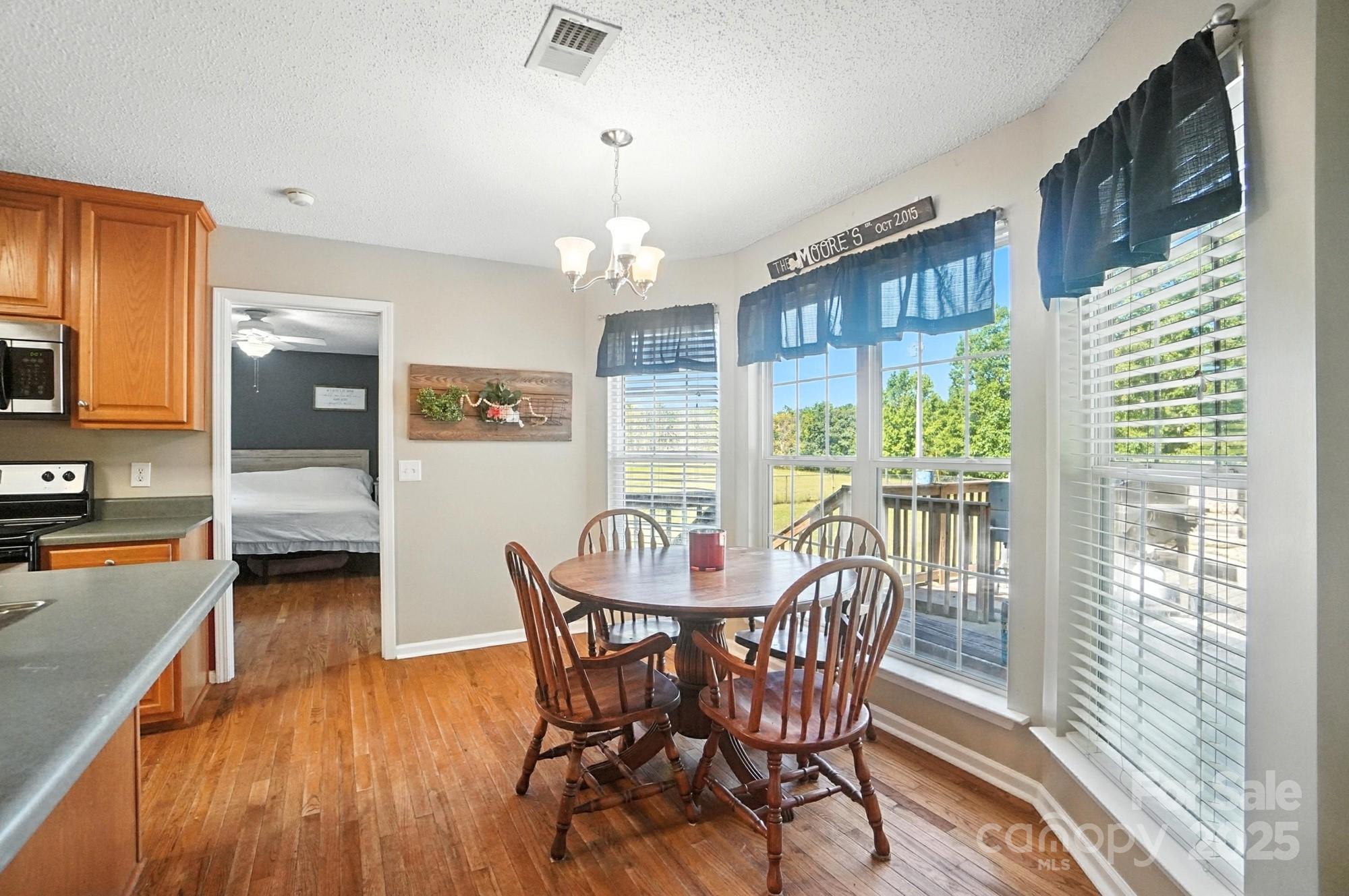 1116 State Rd S-29-770 Kershaw, SC 29067 - Photo 14 of 48 a view of a dining room with furniture window and wooden floor