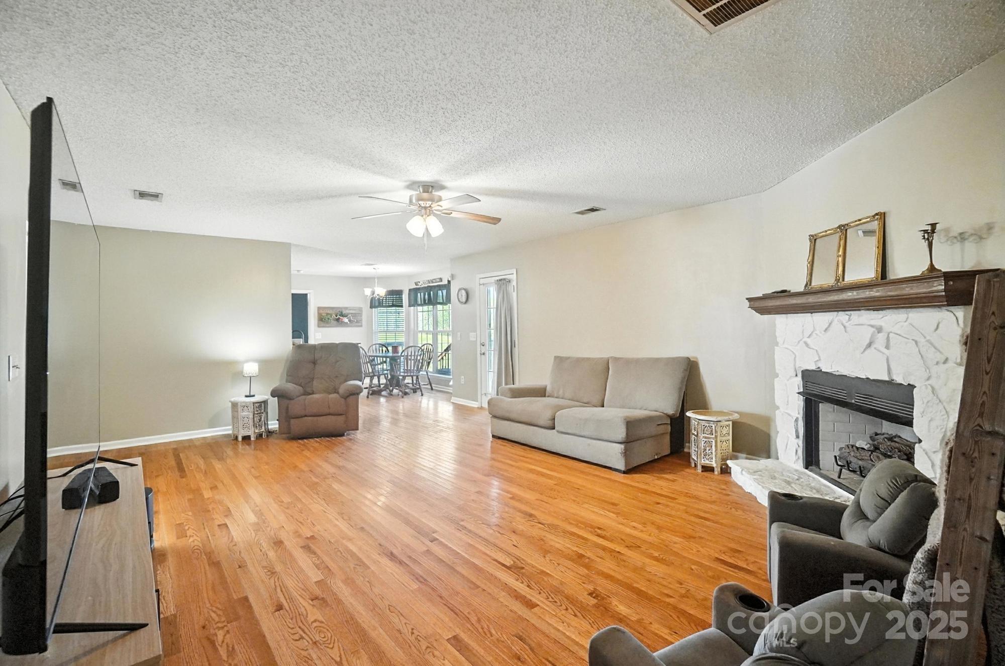 1116 State Rd S-29-770 Kershaw, SC 29067 - Photo 18 of 48 a living room with furniture and a fireplace