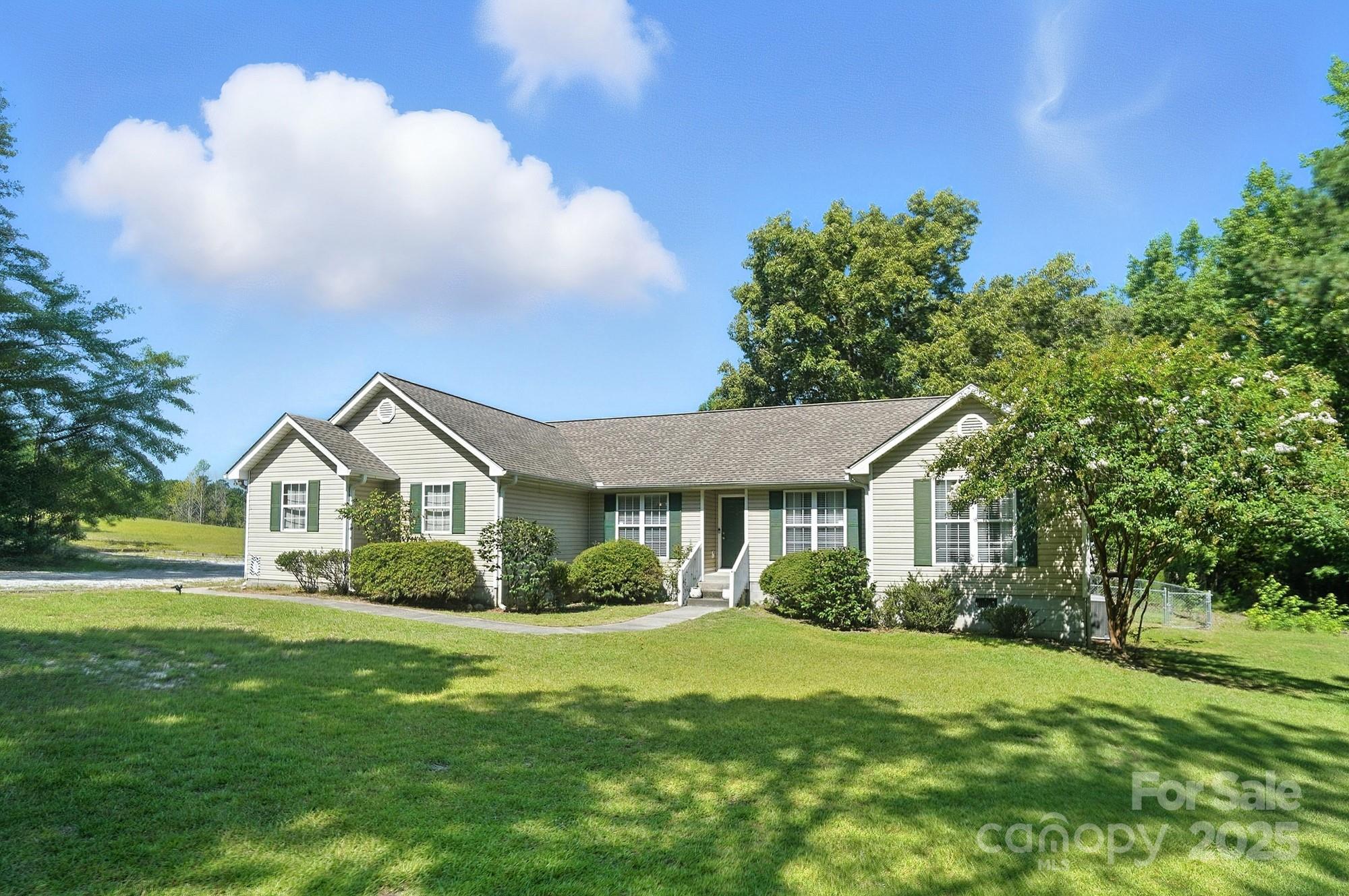 1116 State Rd S-29-770 Kershaw, SC 29067 - Photo 2 of 48 a front view of a house with a garden