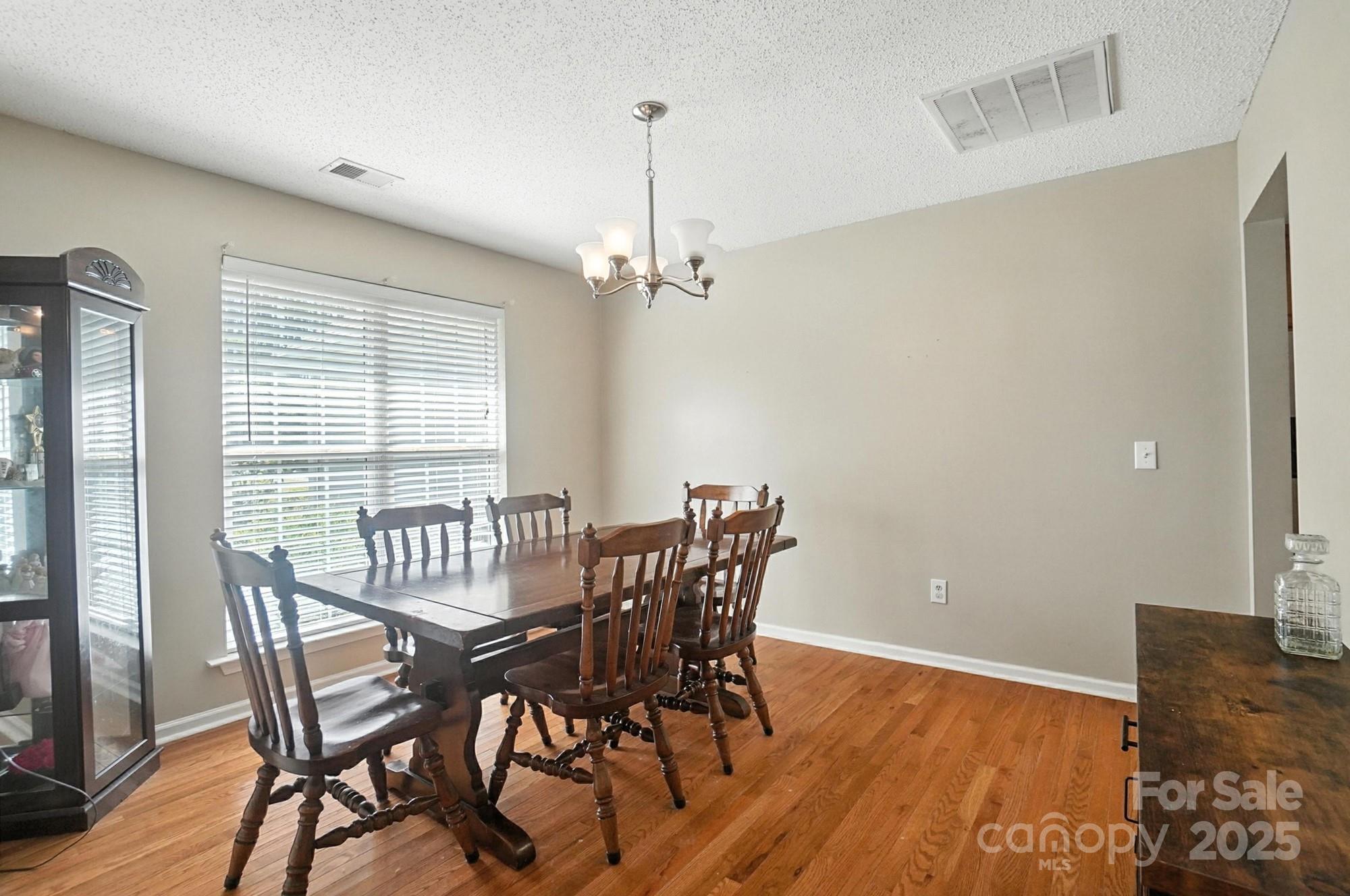 1116 State Rd S-29-770 Kershaw, SC 29067 - Photo 27 of 48 a view of a dining room with furniture window and wooden floor