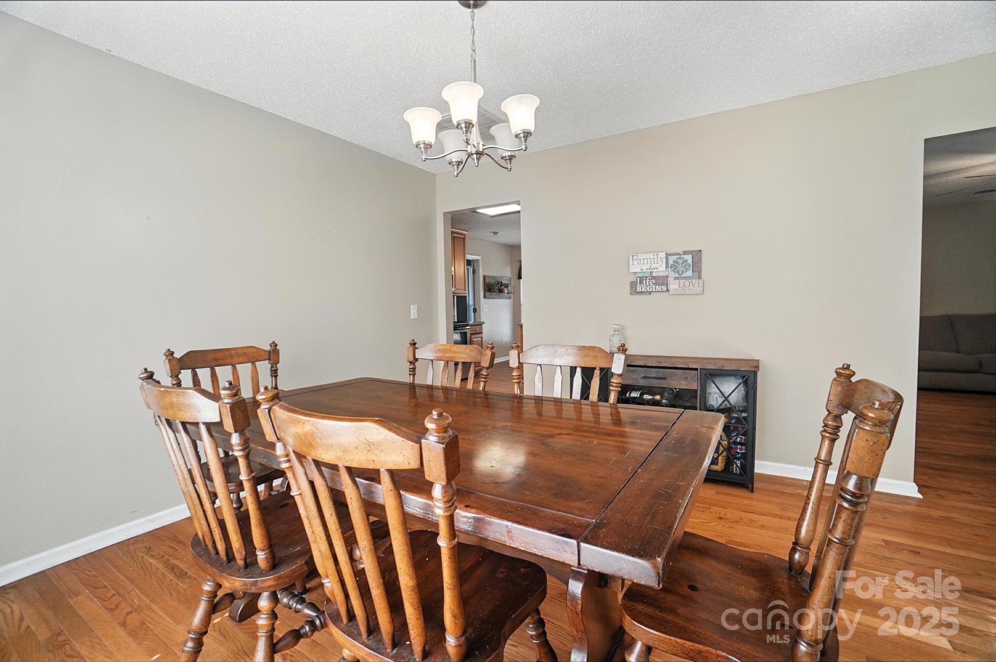 1116 State Rd S-29-770 Kershaw, SC 29067 - Photo 28 of 48 a view of a dining room with furniture and wooden floor