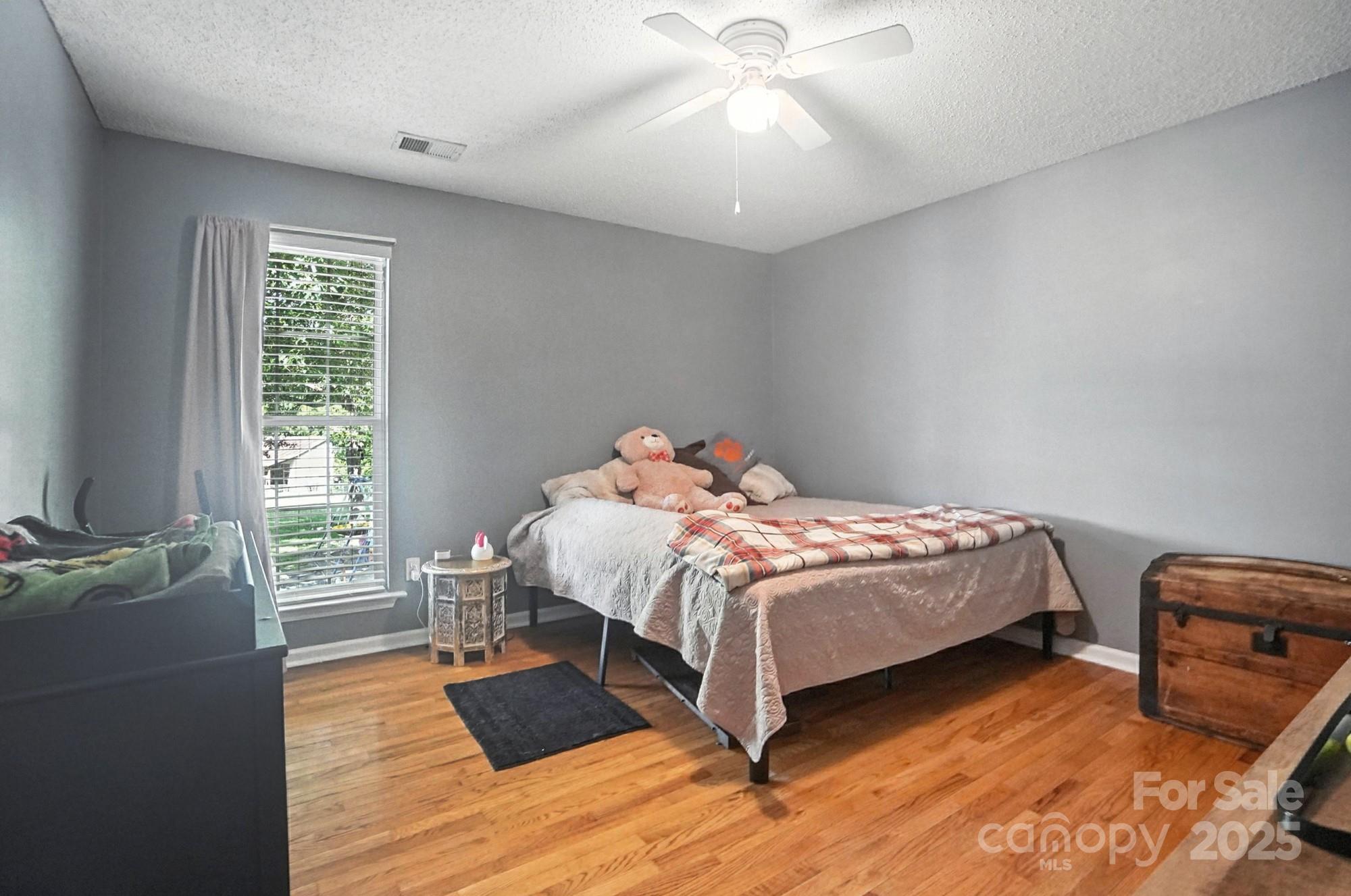 1116 State Rd S-29-770 Kershaw, SC 29067 - Photo 33 of 48 a bedroom with a bed and wooden floor