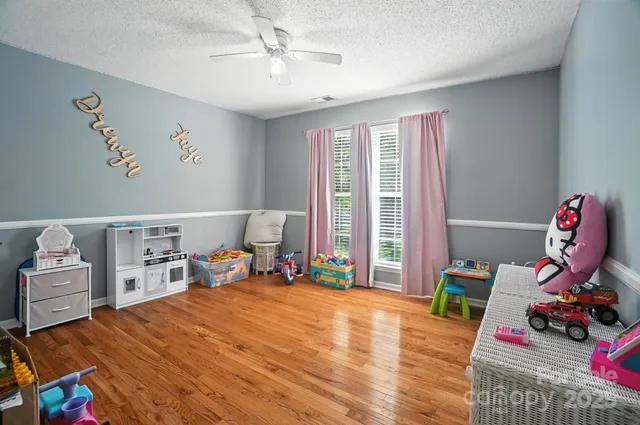 a bed room with a bed and a tv