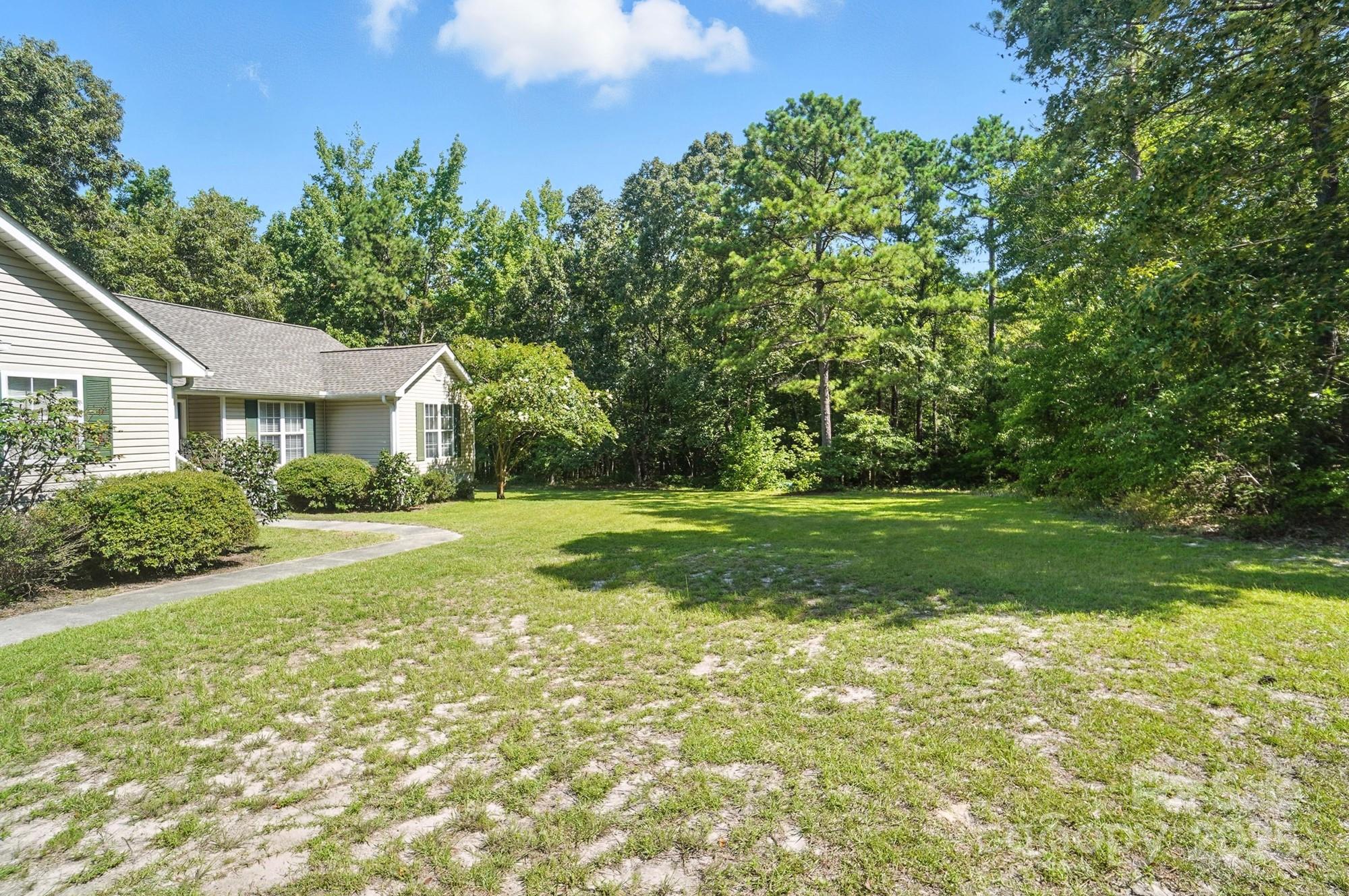 1116 State Rd S-29-770 Kershaw, SC 29067 - Photo 4 of 48 a view of a house with yard and tree s