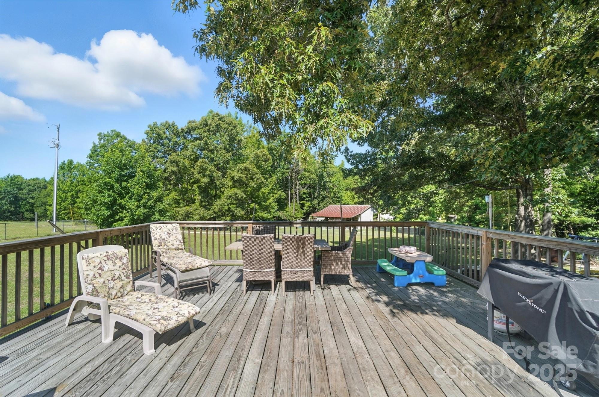 1116 State Rd S-29-770 Kershaw, SC 29067 - Photo 41 of 48 a view of a chairs and table on the deck