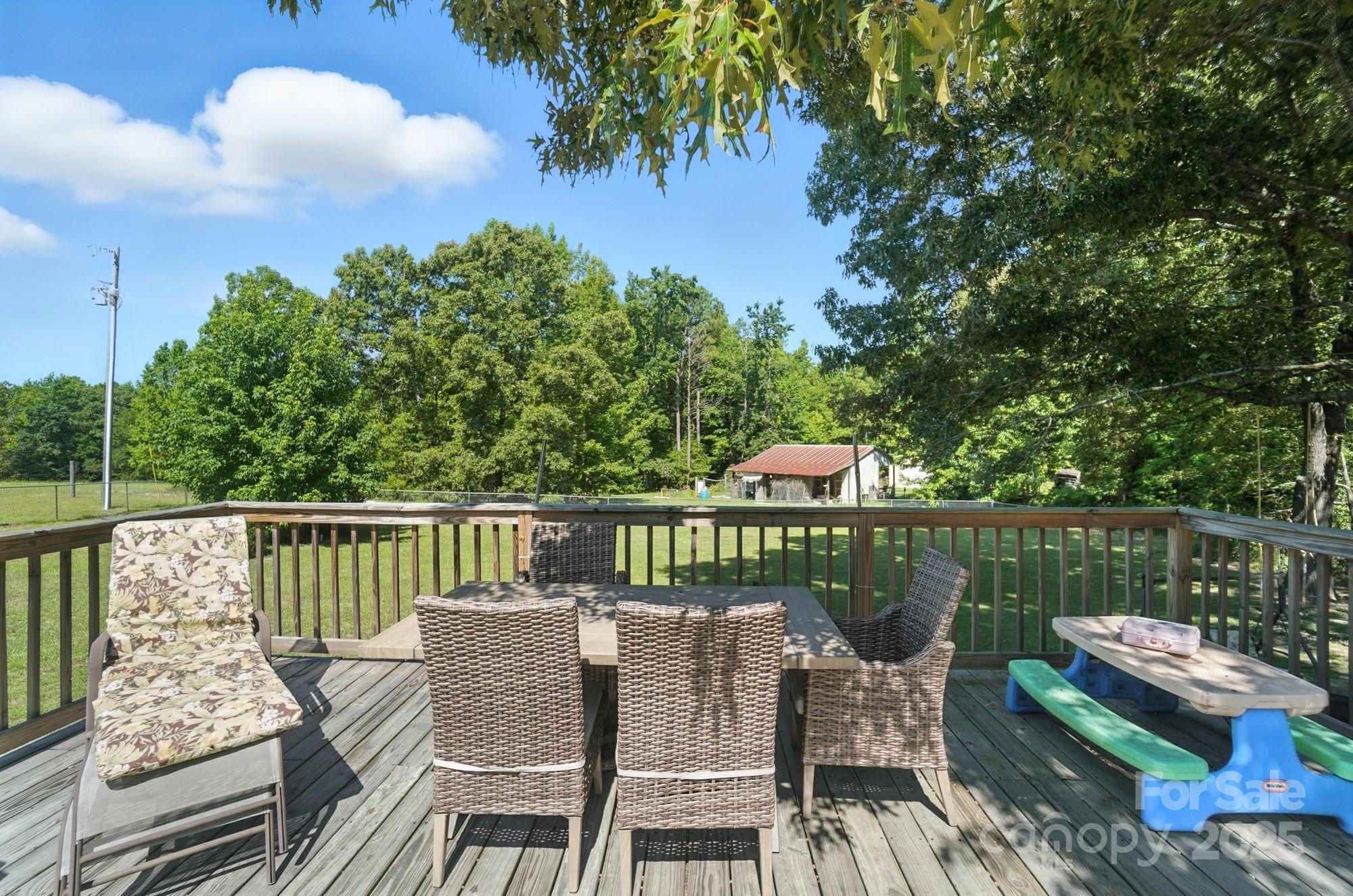 1116 State Rd S-29-770 Kershaw, SC 29067 - Photo 44 of 48 a view of a chairs and table on the deck